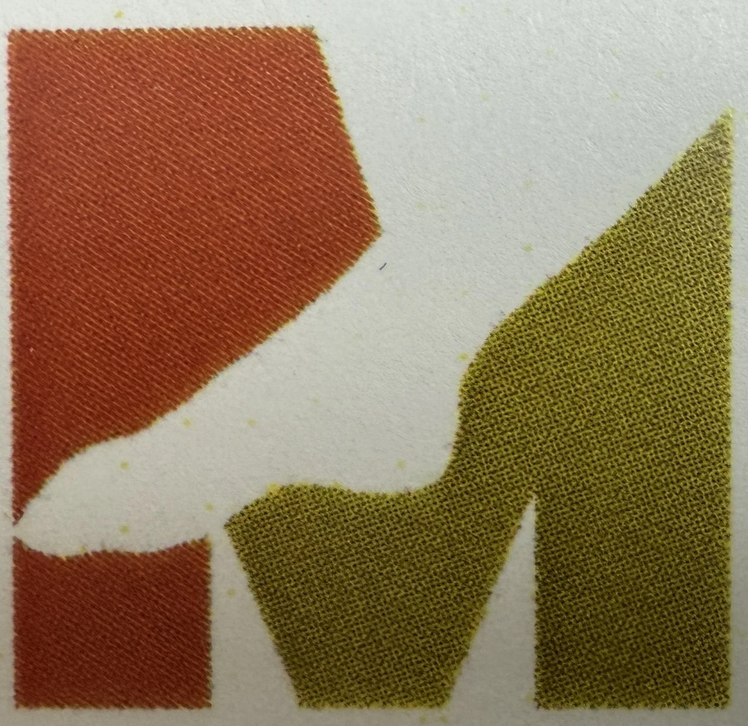Close-up of printed shapes in red, white, and yellow with a textured, dotted pattern. The business logo