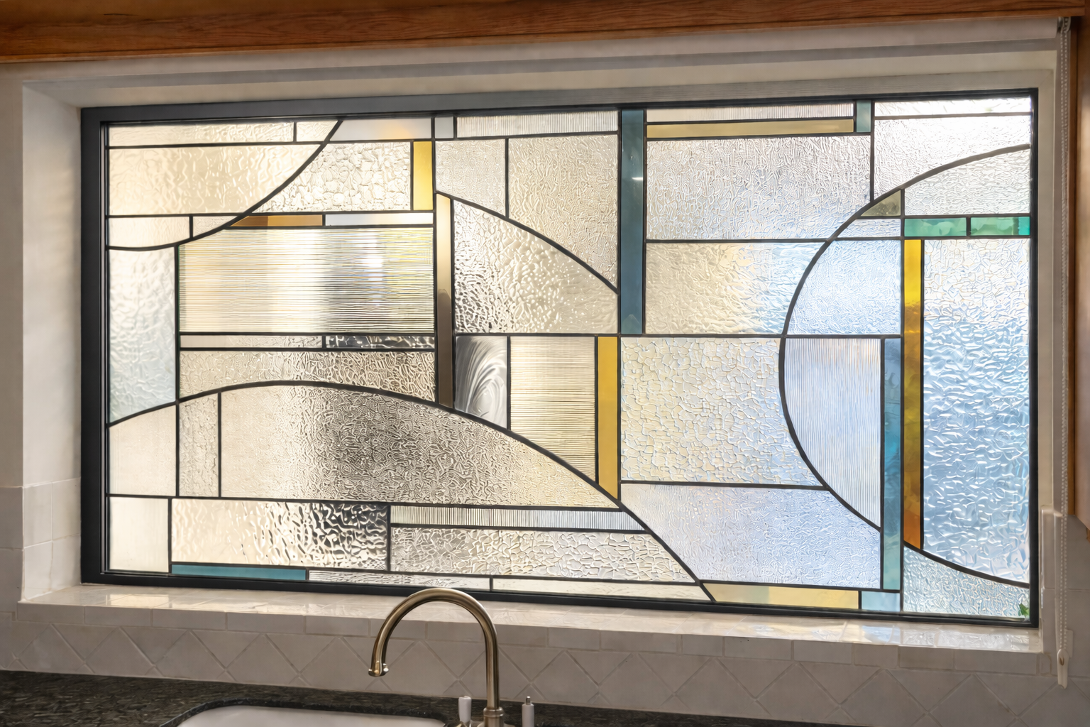 Geometric stained glass above kitchen sink.png