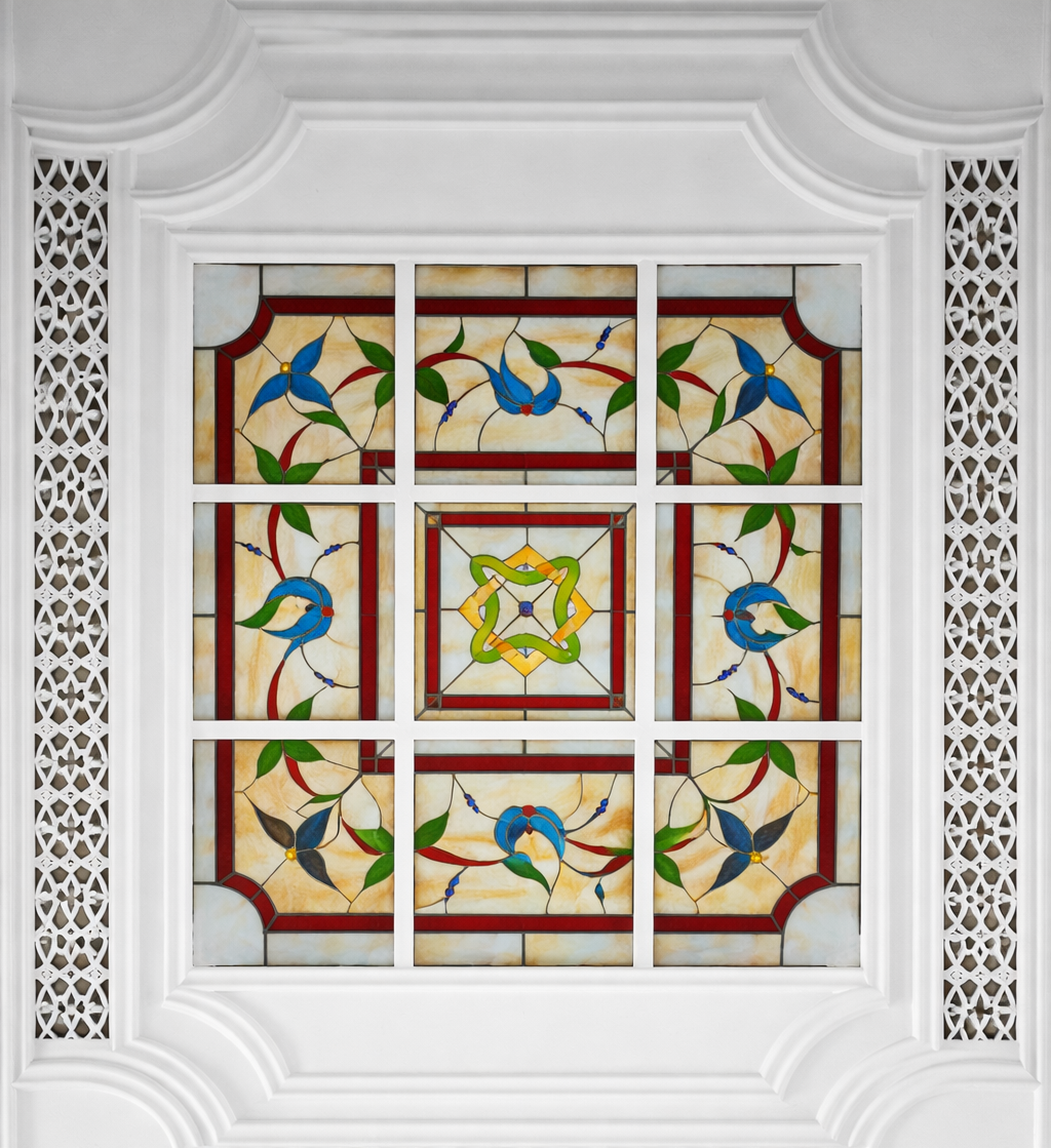 Stained glass ceiling with bird motifs.png
