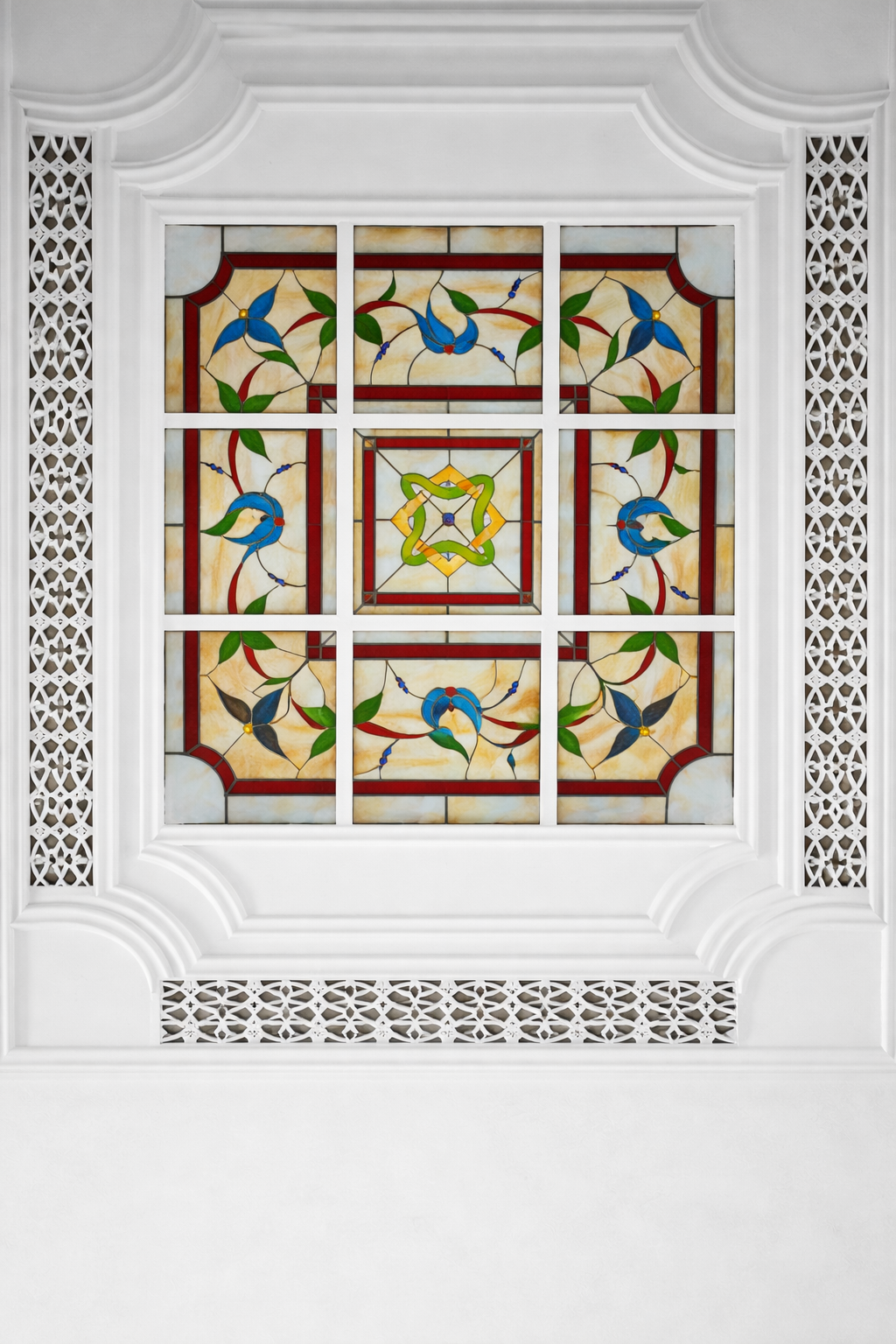 Stained glass ceiling with bird motifs.png