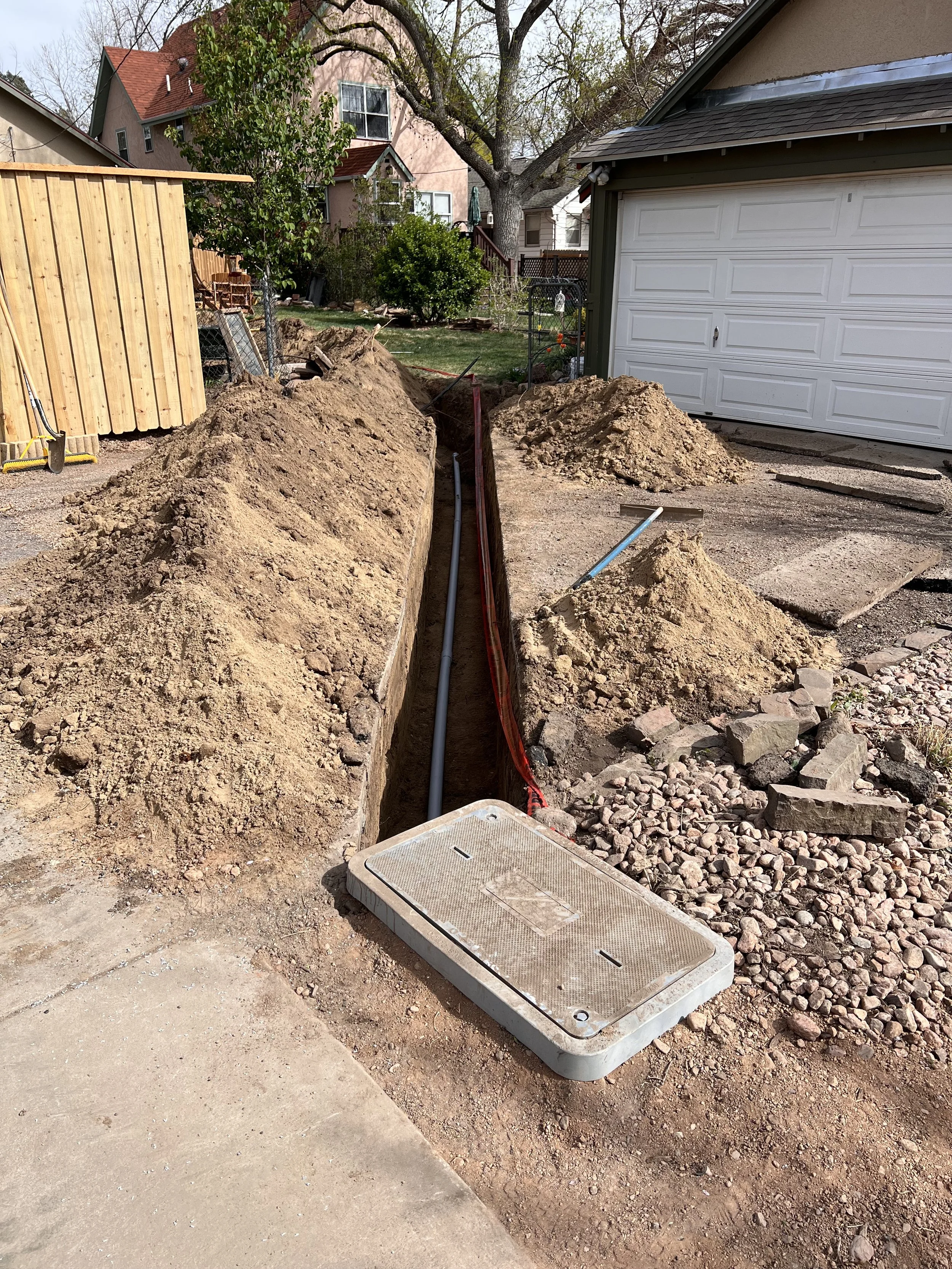 Trench excavation in the Broadmoor area of Colorado Springs by American Demo and Dirt.