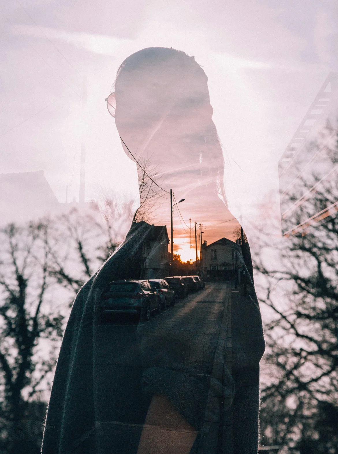 Artful double-exposure photo of a woman and her neighborhood street