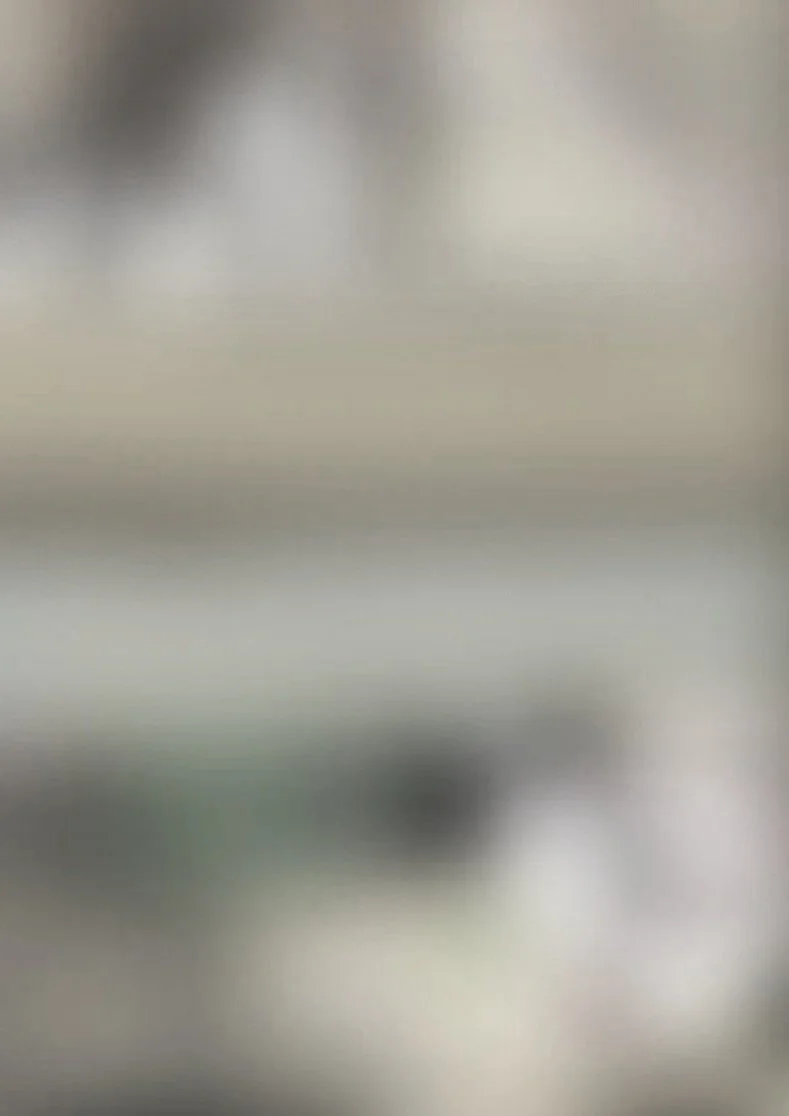 The image is blurry and indistinct, making it difficult to identify specific objects or details.