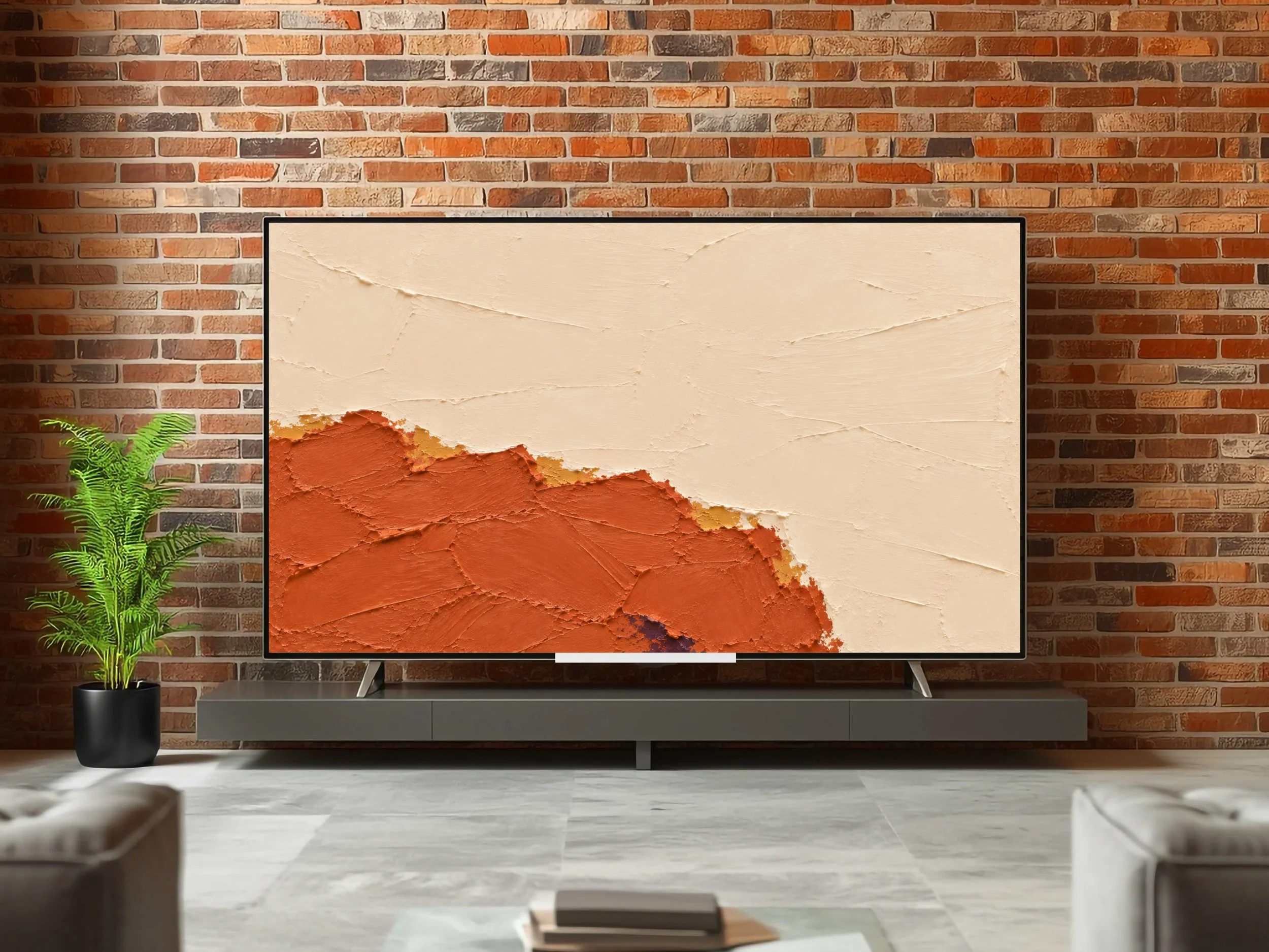 Chromatic Earth warm terracotta and cream abstract TV art against a brick wall.