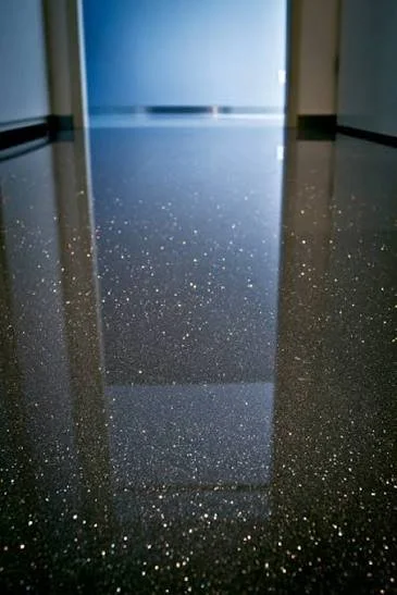 Reflective black speckled polished floor in a modern hallway