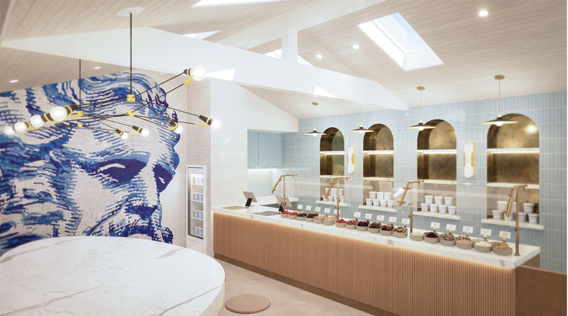 Modern frozen yogurt shop with multiple gelato flavors on display, a large artistic portrait of a man on the wall, and stylish lighting fixtures.