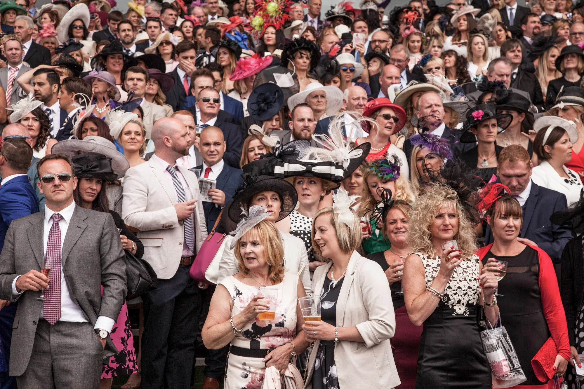 Racegoers gathered in colourful hats at Royal Ascot.