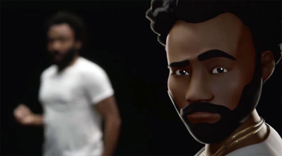 A 3D animated male figure with dark hair, a beard, and a serious expression, wearing a white shirt. In the background, a blurred real person in a white shirt is standing.