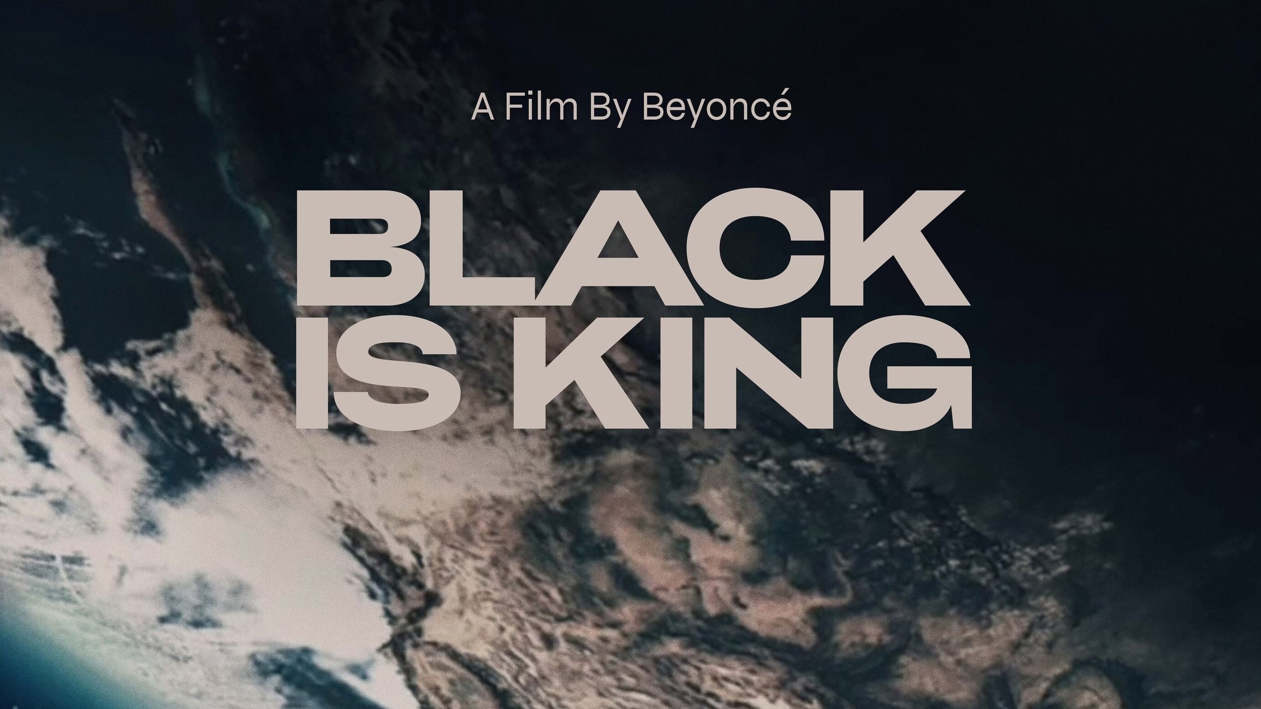 Title screen for a film by Beyoncé titled 'Black Is King' over a background of Earth's view from space showing landmasses and oceans. Disney+
