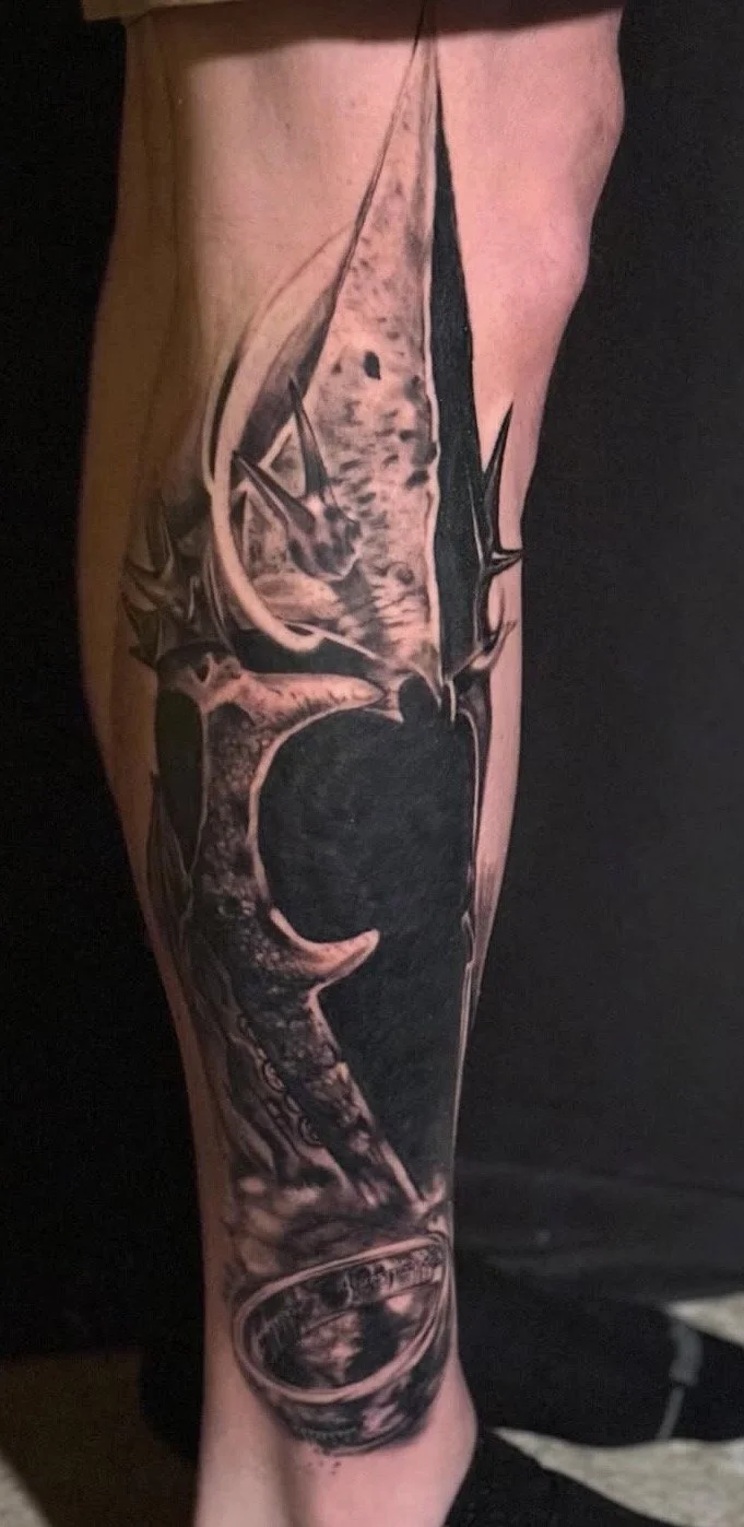 Black and grey realism Witch King of Angmar tattoo on a leg by Altered Tattoo Co