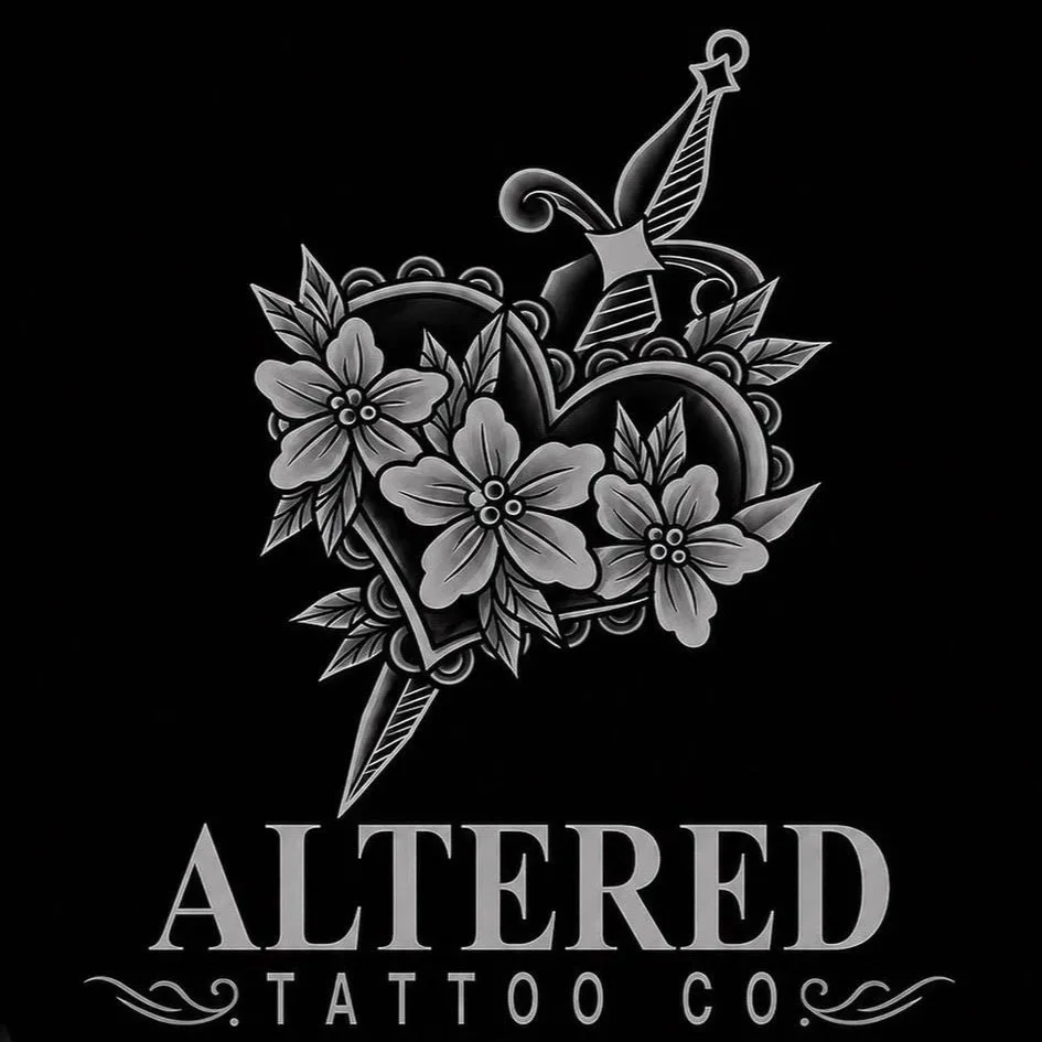 Black and gray tattoo design featuring a heart pierced by a dagger, surrounded by flowers and leaves, with the words "Altered Tattoo Co" beneath.