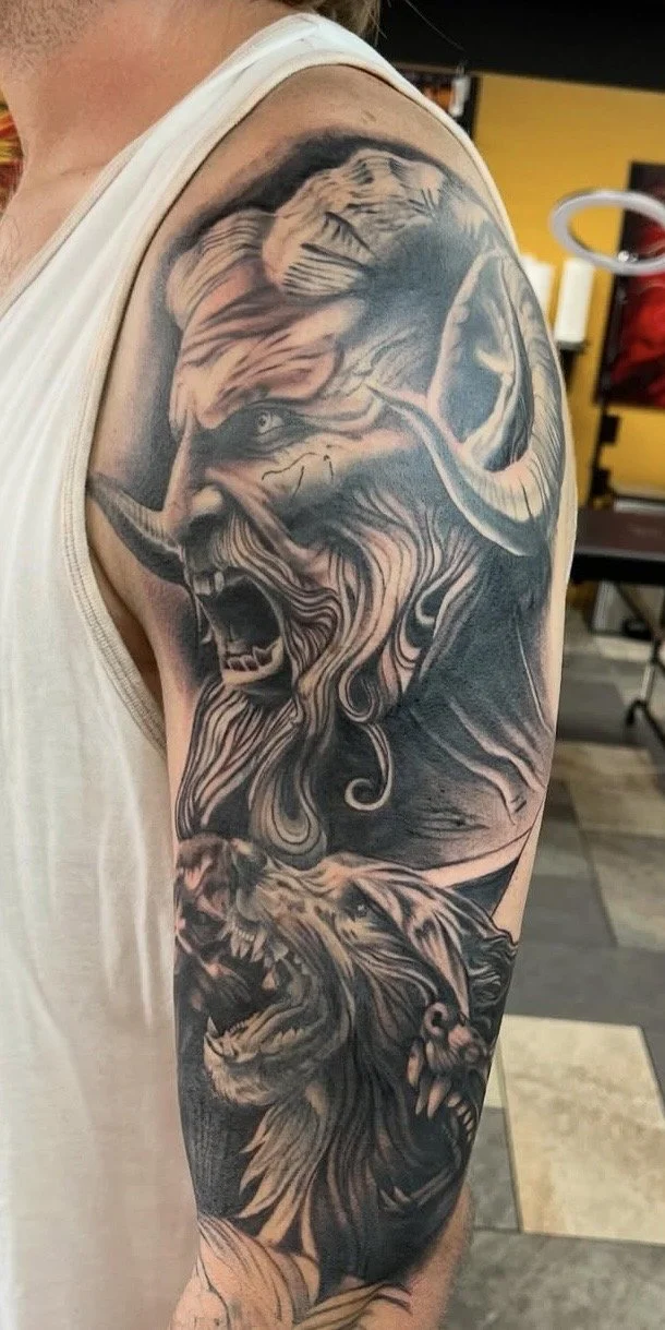 Black and grey realism Hades tattoo on a shoulder by Altered Tattoo Co