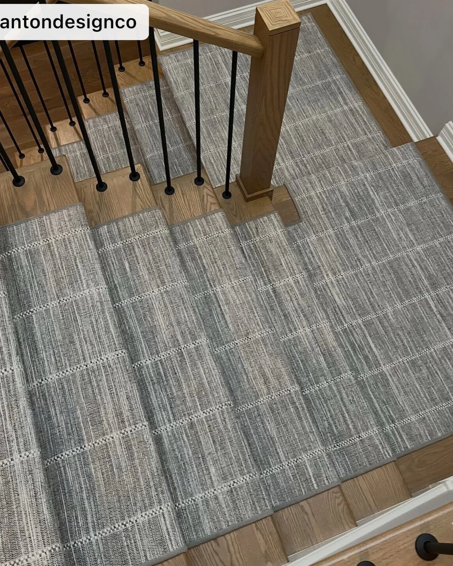 Emmett brings tailored sophistication to the staircase with its softly structured grid pattern and richly textured weave. Subtle variations of warm gray, ivory, and taupe create a beautifully heathered effect, while delicate linear detailing adds dim