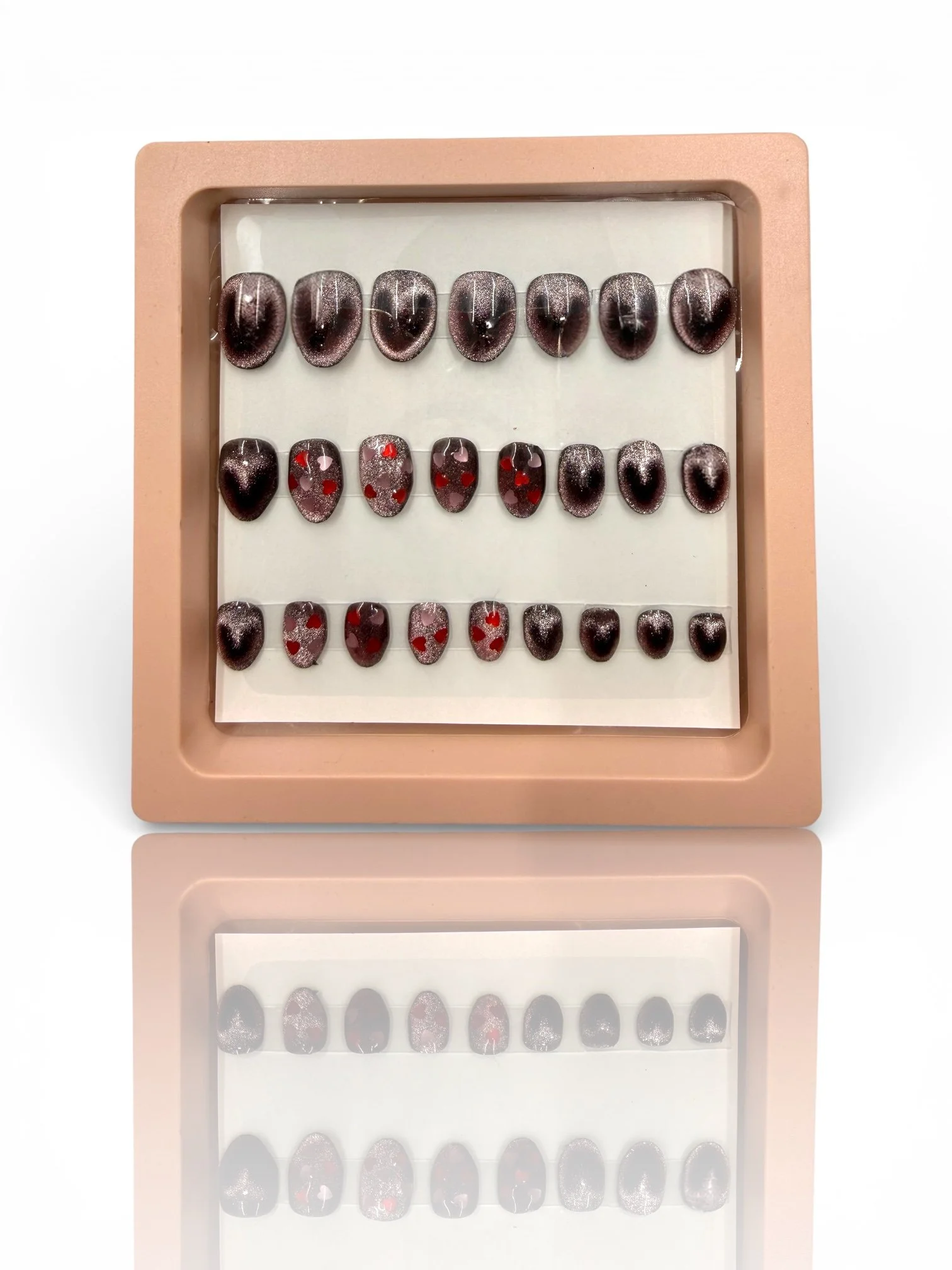 kids Black and silver glitter almond-shaped press-on nails with black heart designs, red accents, and sparkling ombré details.