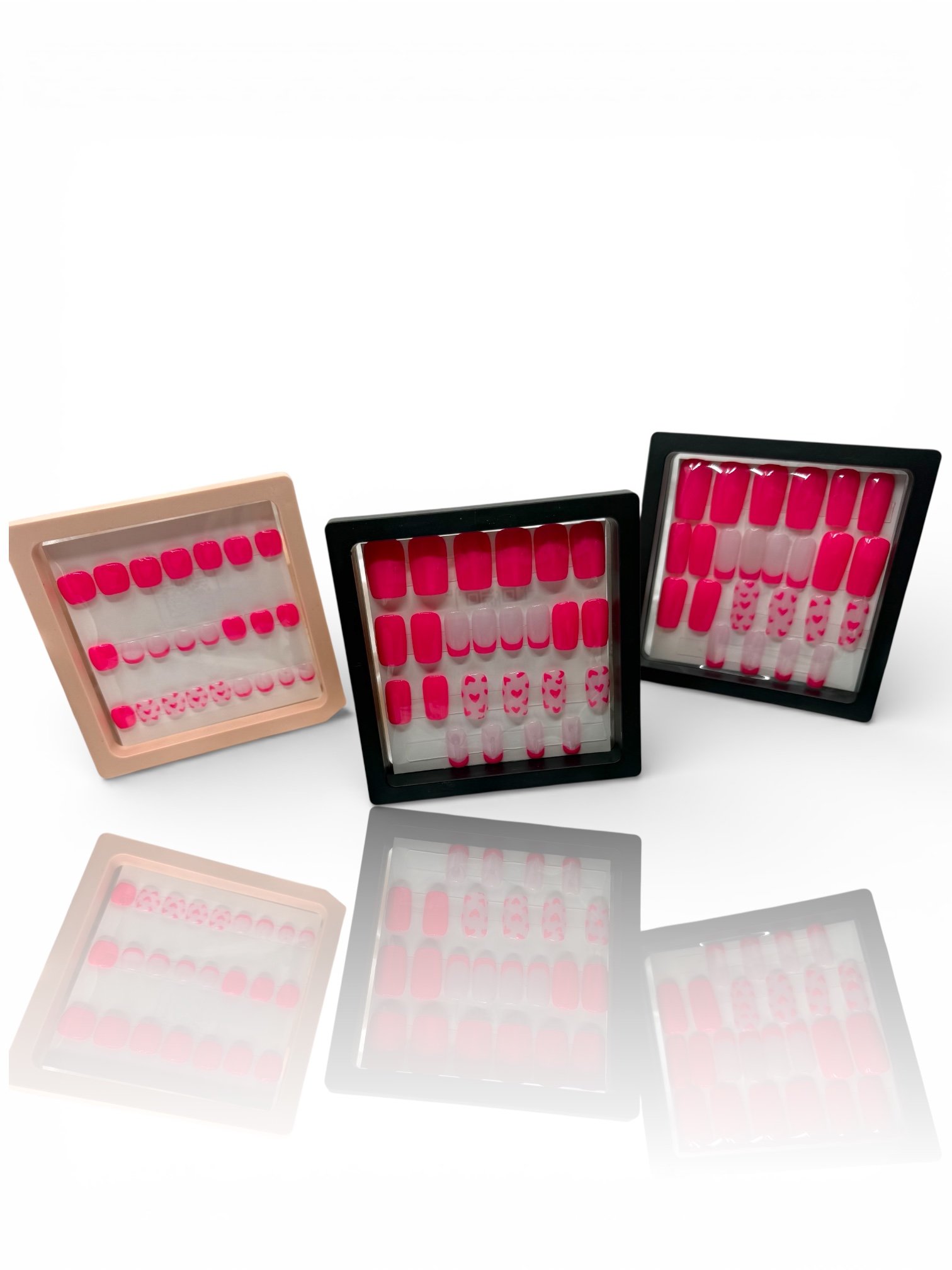 long Glossy bright pink square press-on nails with light pink French tips and adorable pink heart designs.