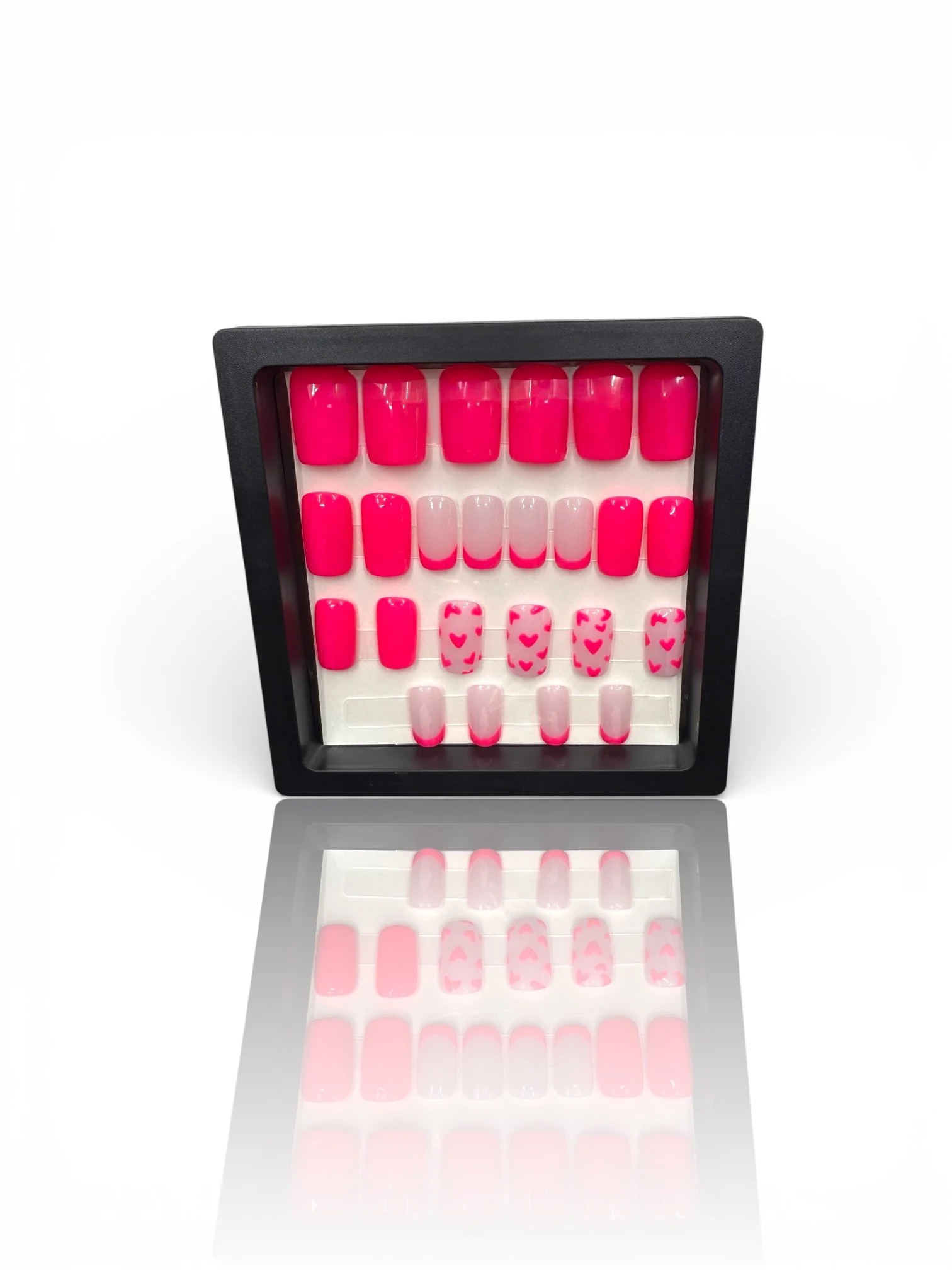 short Glossy bright pink square press-on nails with light pink French tips and adorable pink heart designs.