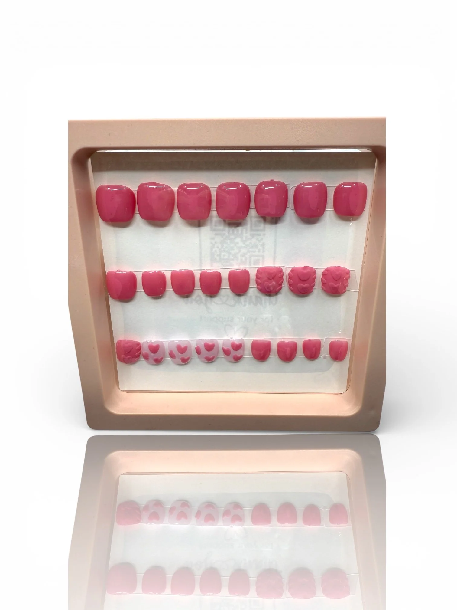 kids Pink almond-shaped press-on nails with 3D sweater-knit heart designs, raised textures, and pink heart accents.
