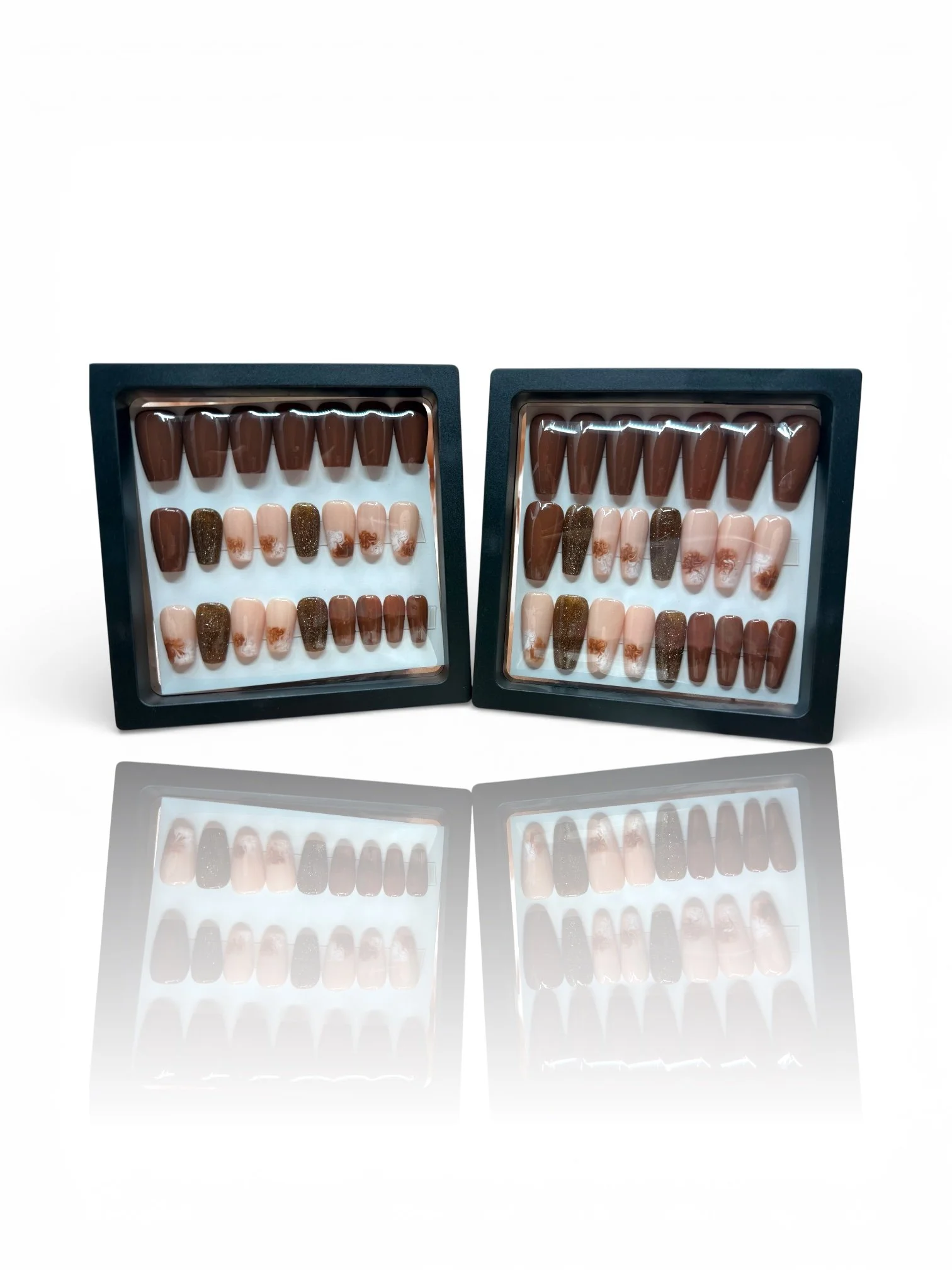 long Chocolate brown coffin-shaped press-on nails with nude floral accents and sparkling brown glitter designs.