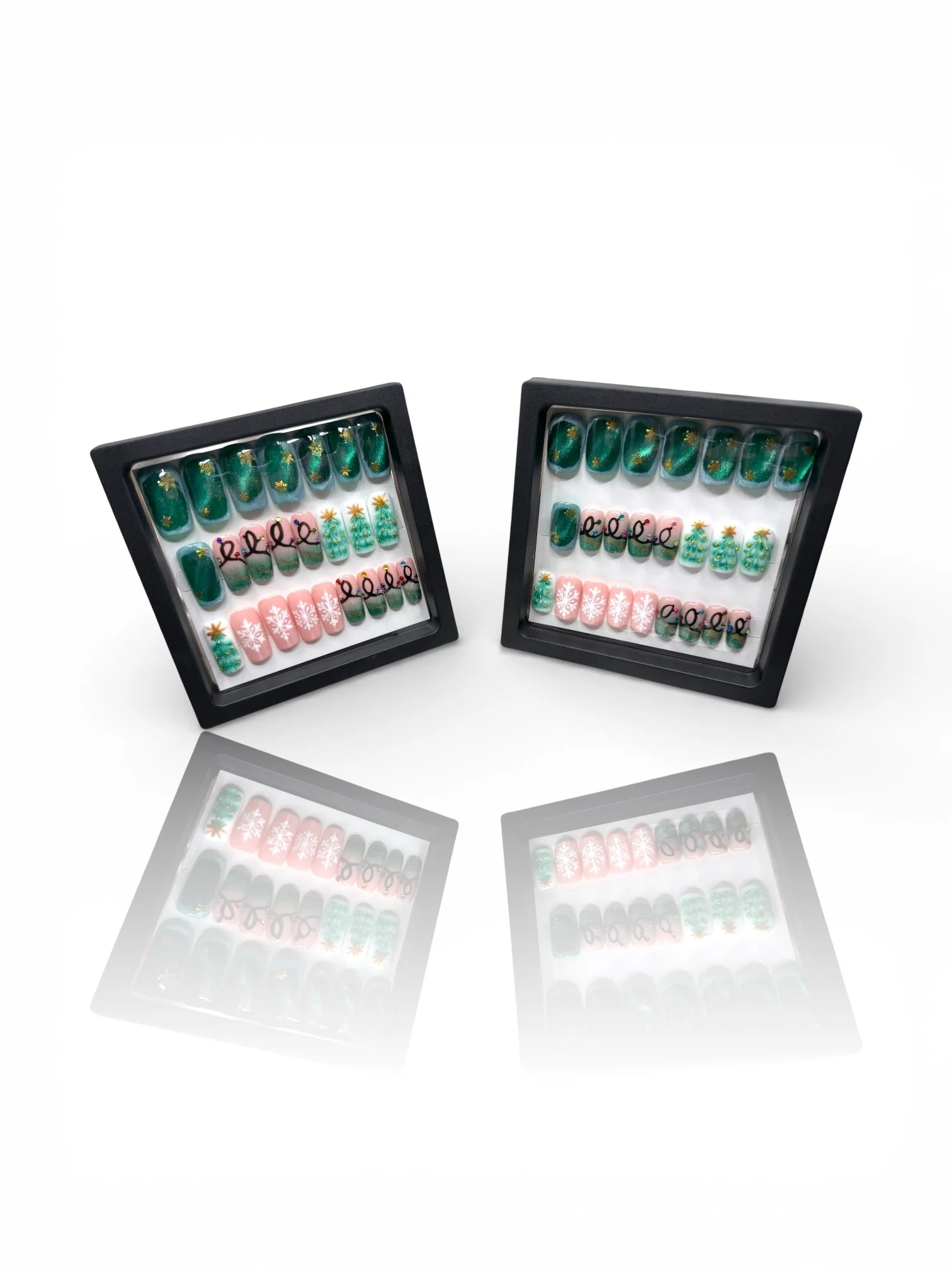 long Green Christmas square press-on nails with gold accents, Christmas trees, pink snowflakes, and festive holiday nail art.
