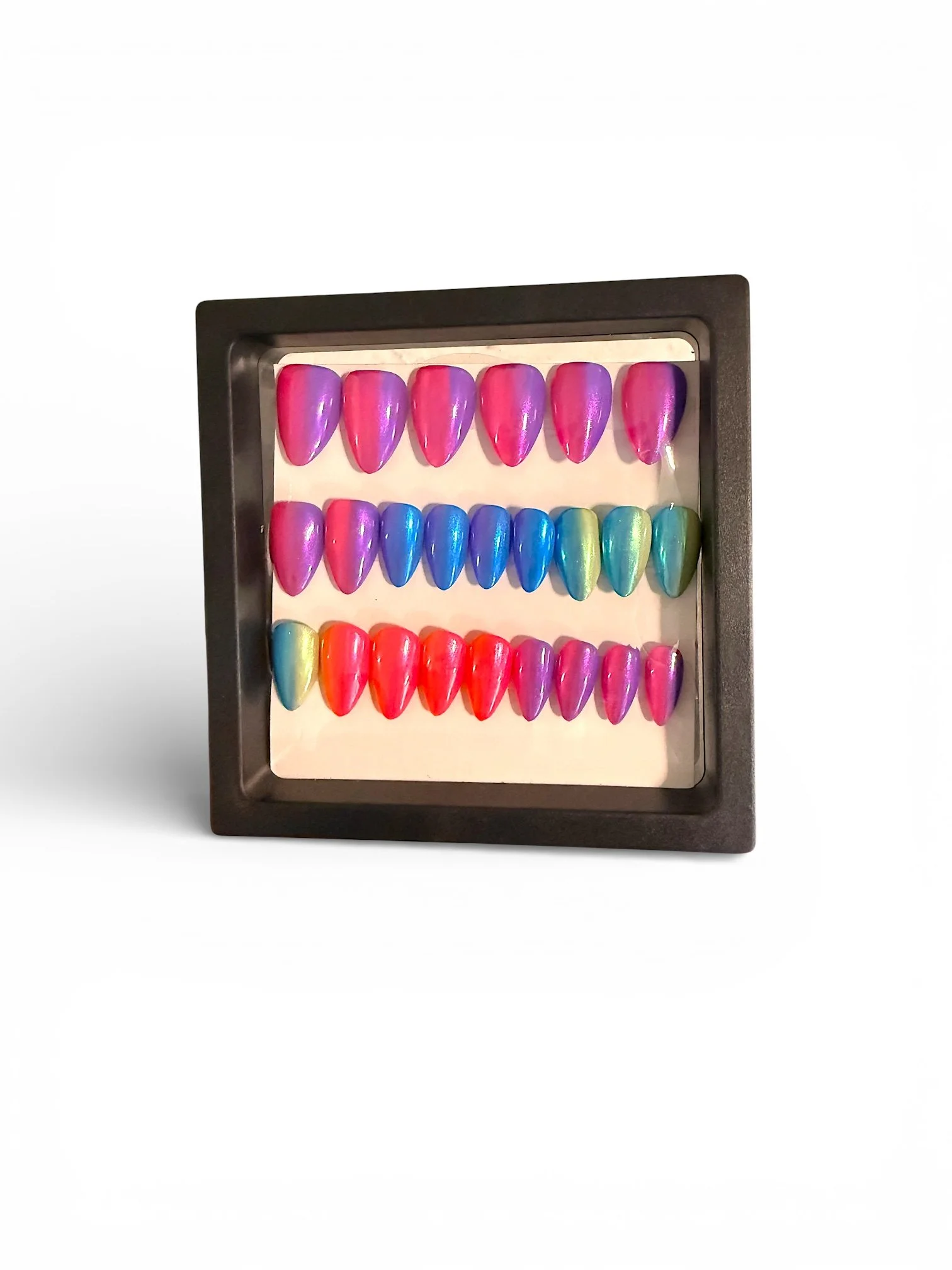 Rainbow ombré chrome almond-shaped press-on nails featuring shimmering pink, purple, blue, teal, and green gradients with a glossy, iridescent metallic finish.  Copy