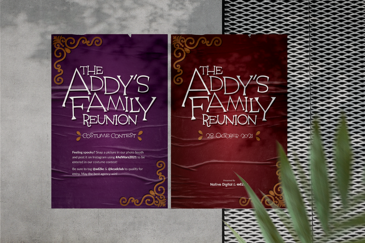 Posters for the Addy's Family Reunion event, one purple and one red, with decorative gold borders and text detailing the date and activities, displayed on a wall with gray concrete and black metal patterned surface.