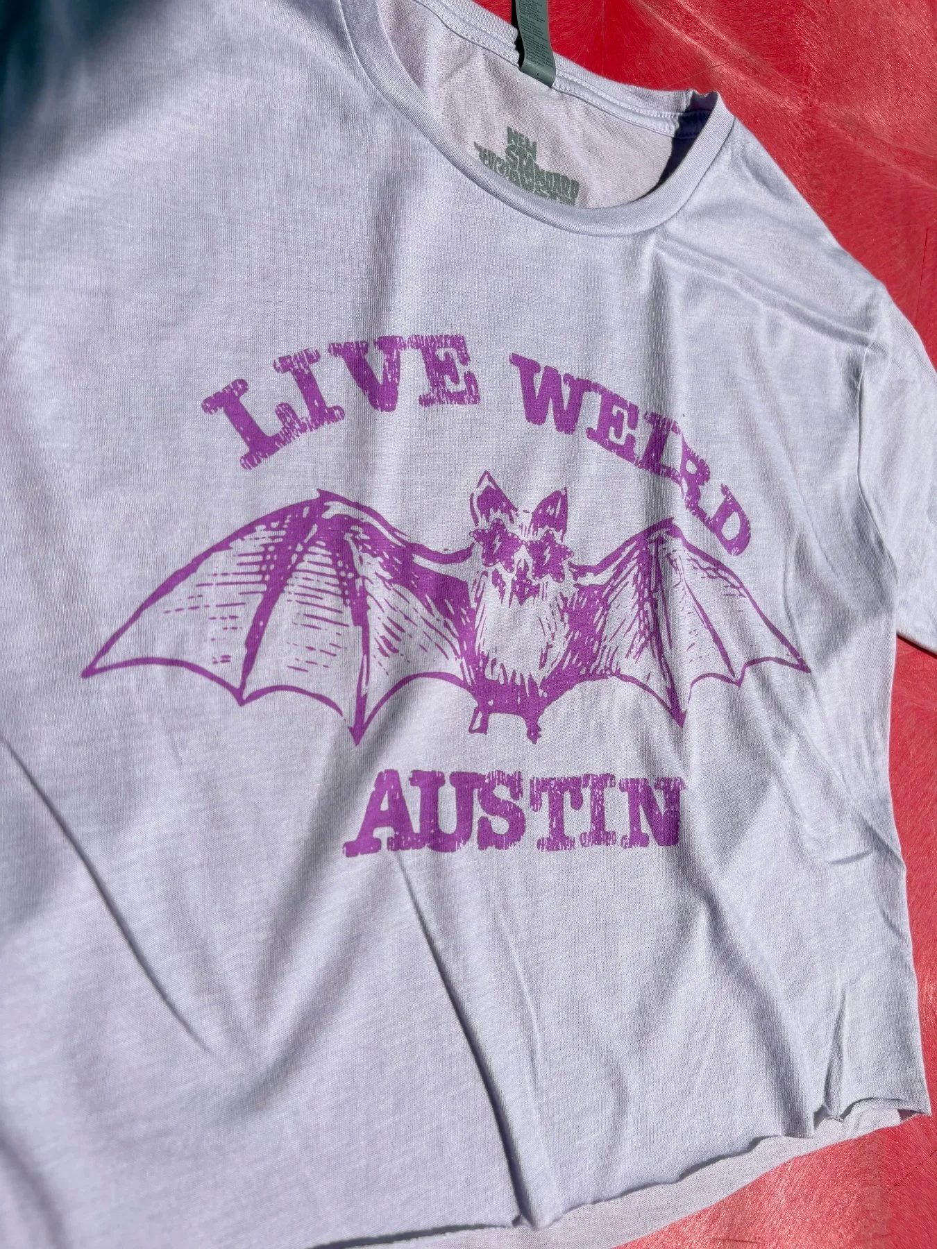 Custom screen printed shirt with Live Weird Austin on it for retail fashion brand in Austin, Tx.