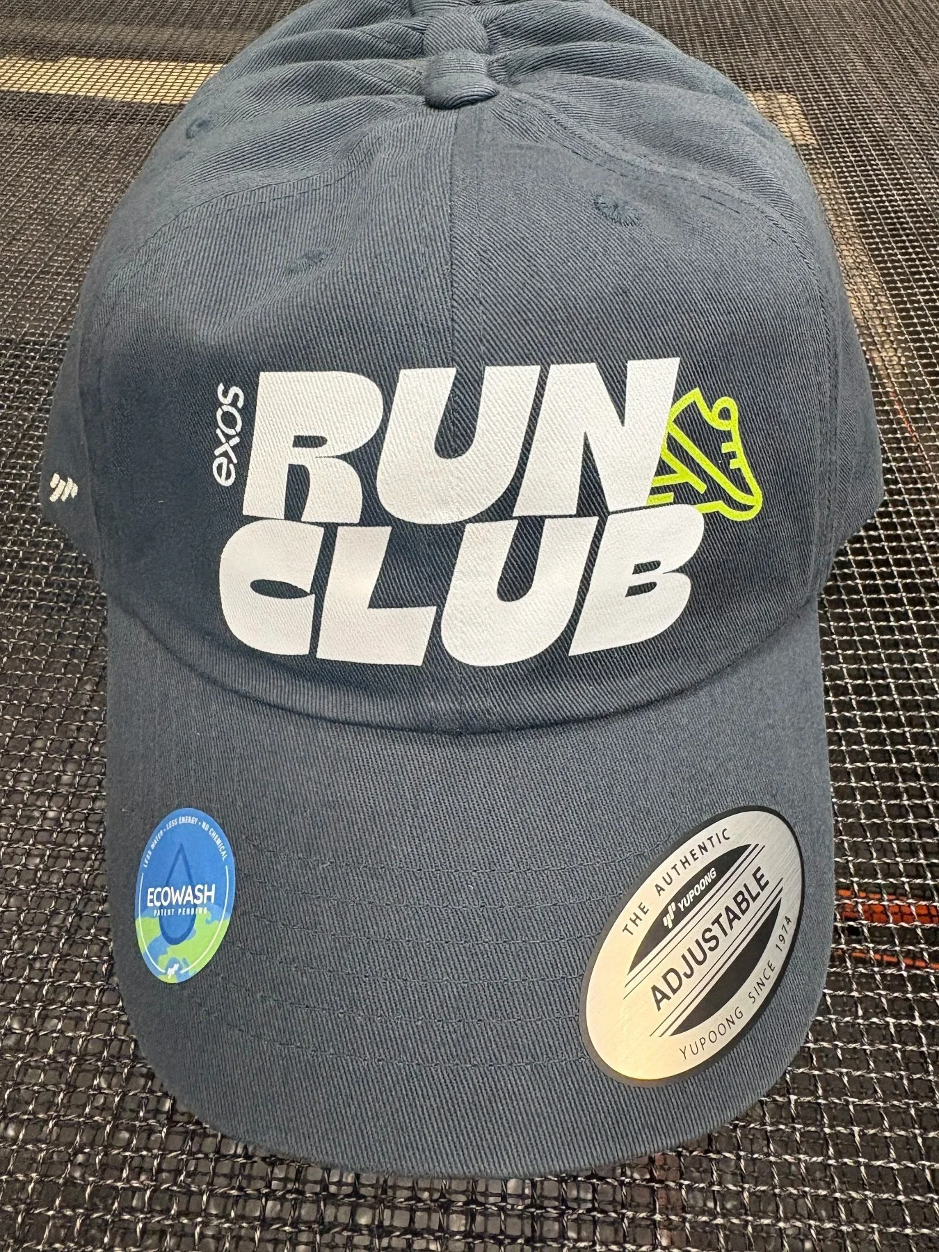 Custom screen printed performance hats and athletic headwear produced for Exos in Austin TX.