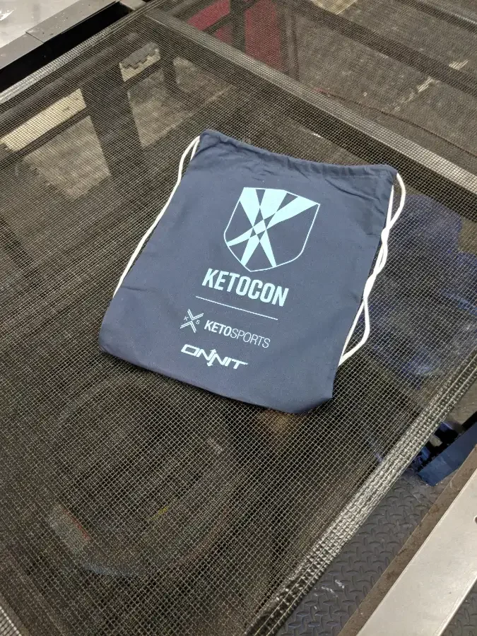 Custom drawstring backpack screen printed for Ketocon event sponsored by Onnit in Austin, TX.