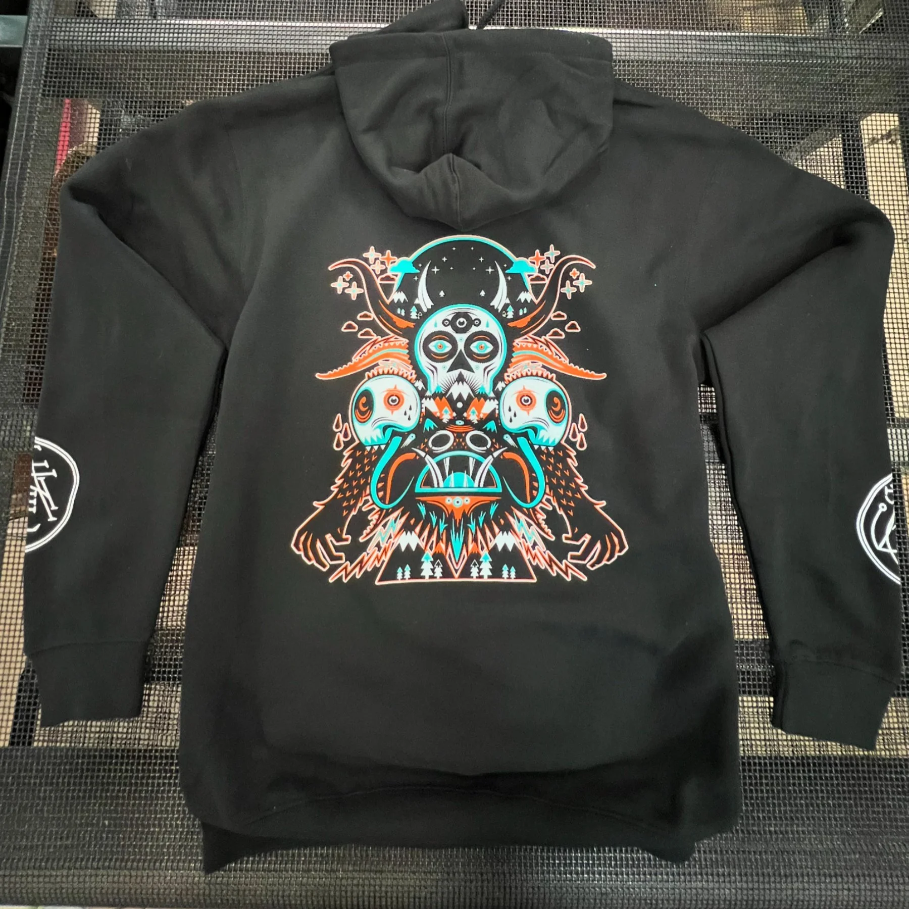 Custom screen printed DJ merchandise and tour hoodies produced for Wakaan music label in Austin TX.