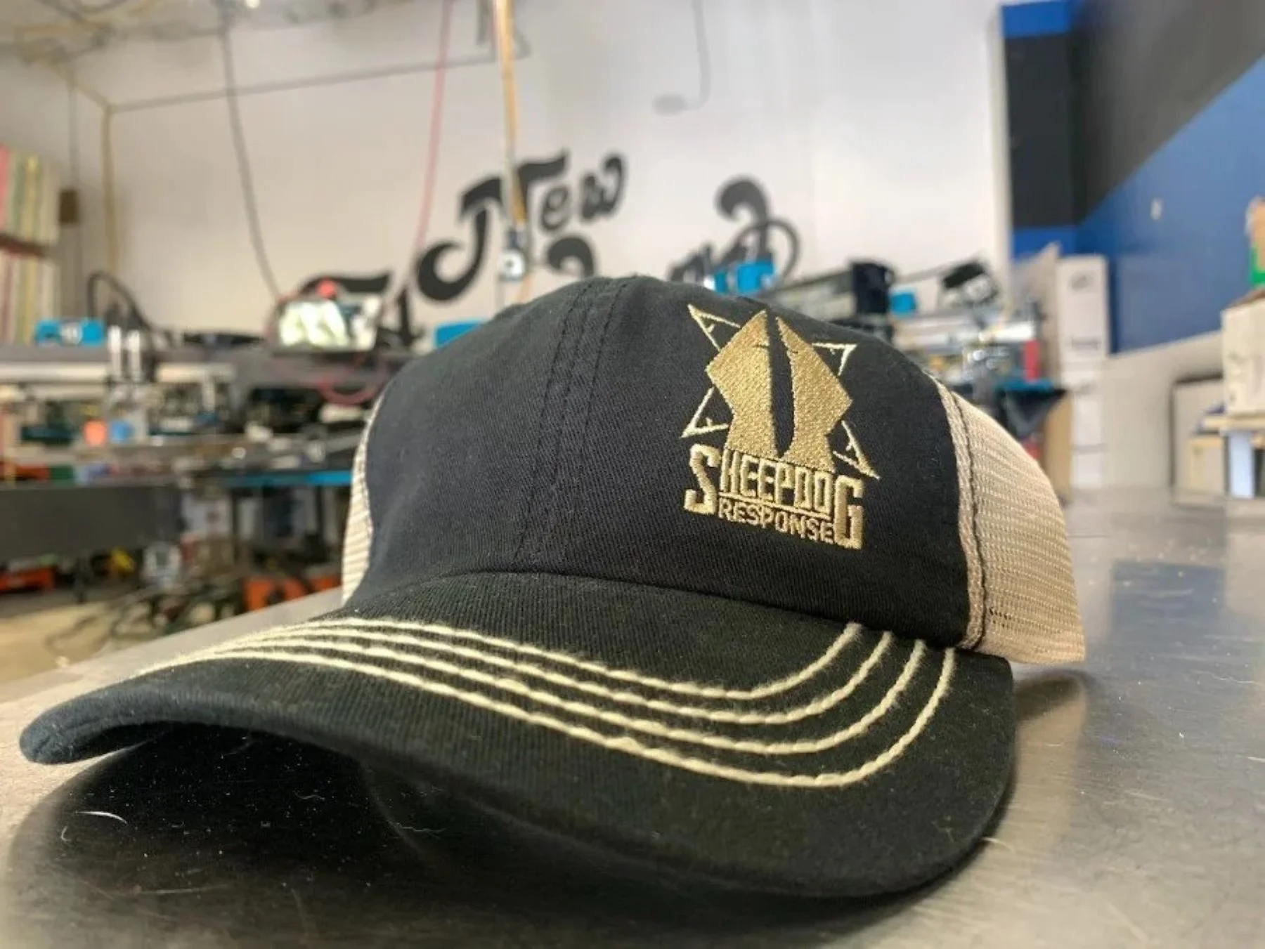 High-density custom embroidered trucker hats produced for Sheepdog Response in Austin TX