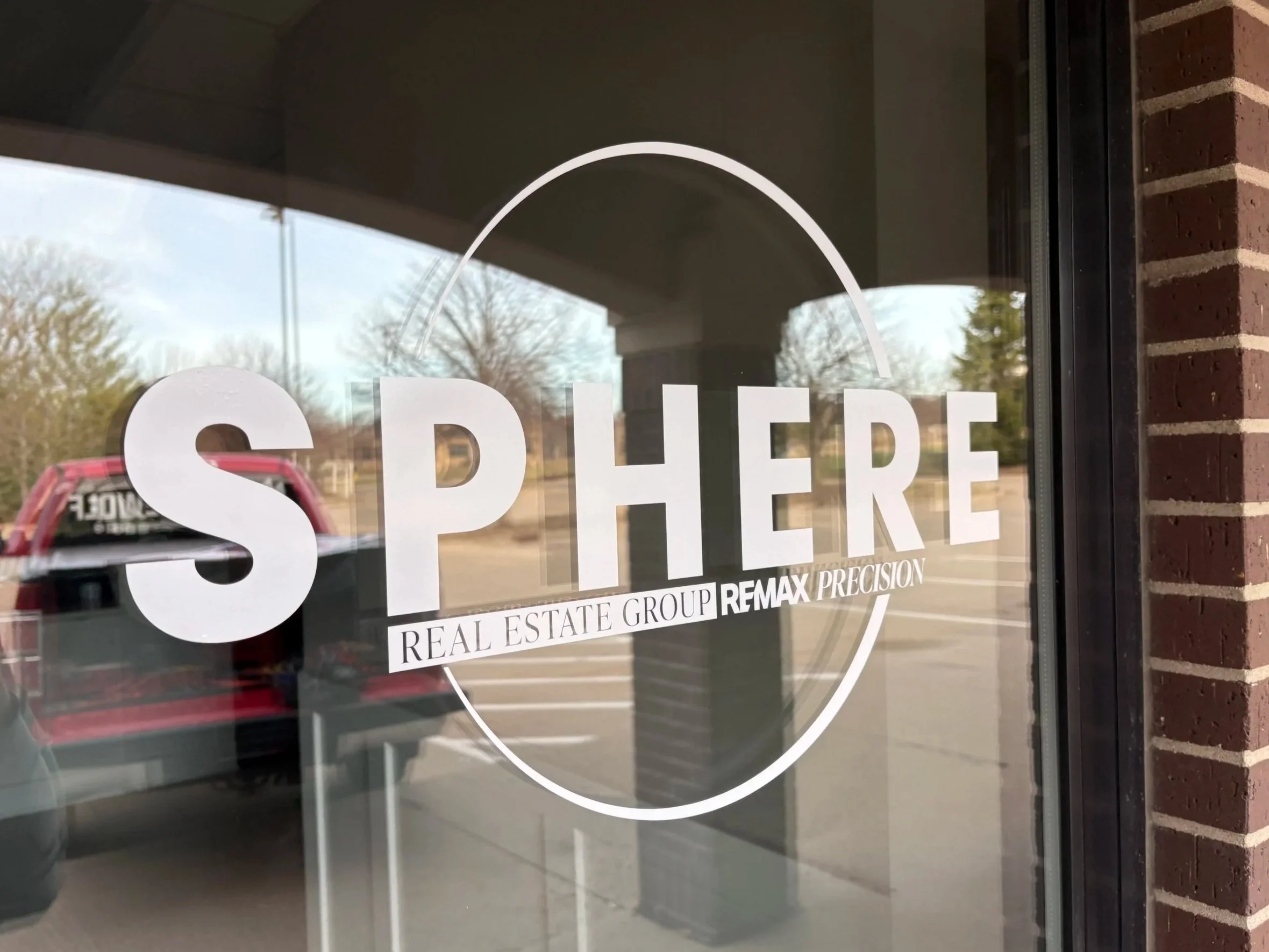 White window vinyl for Sphere Real Estate Group