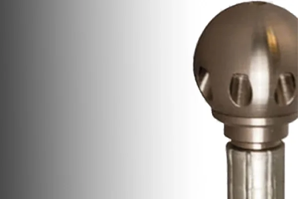 Close-up of a metallic dental implant drill bit.