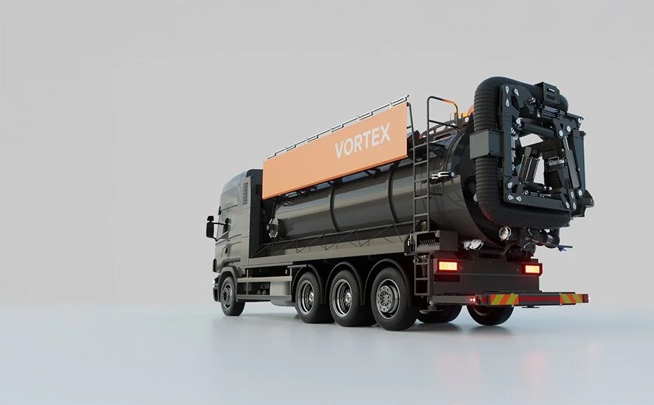A large truck carrying a vacuum excavation machine labeled 'Vortex' on a plain background.