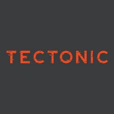 Red distressed "TECTONIC" text on a dark gray background