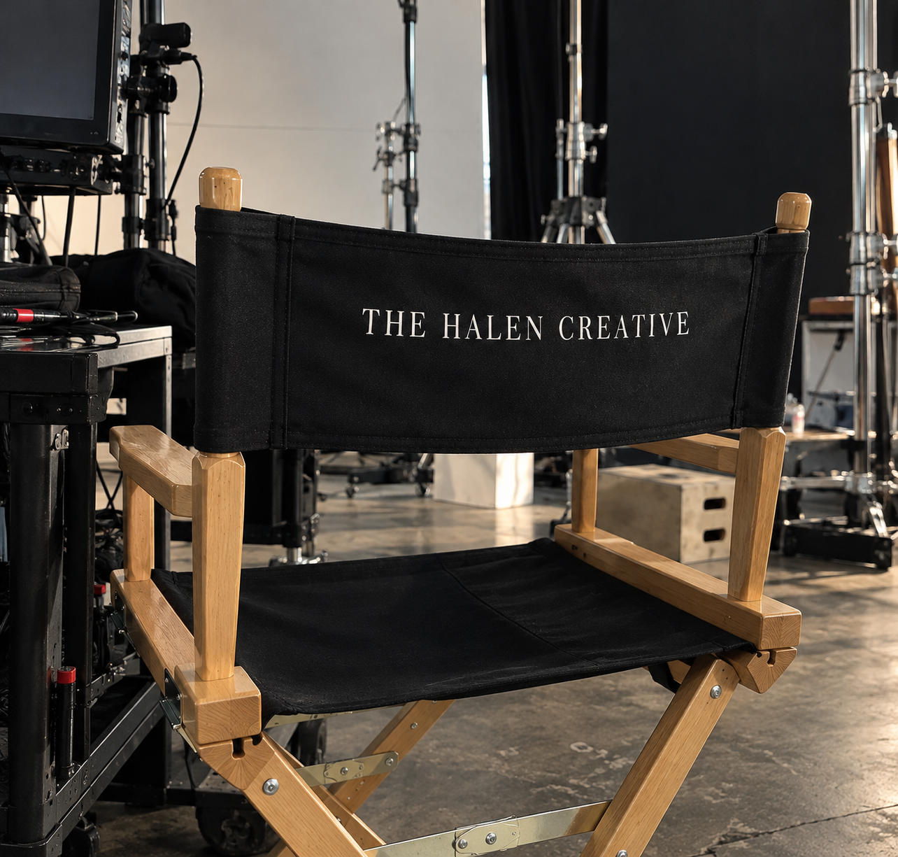 Black director's chair labeled “The Halen Creative” on a film production set