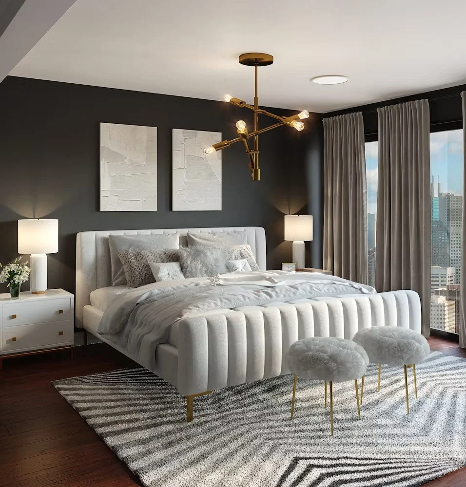 Modern bedroom with dark accent wall, white bed with textured pillows, two white nightstands with lamps, abstract wall art, large window with curtains, stylish chandelier, and plush ottomans.