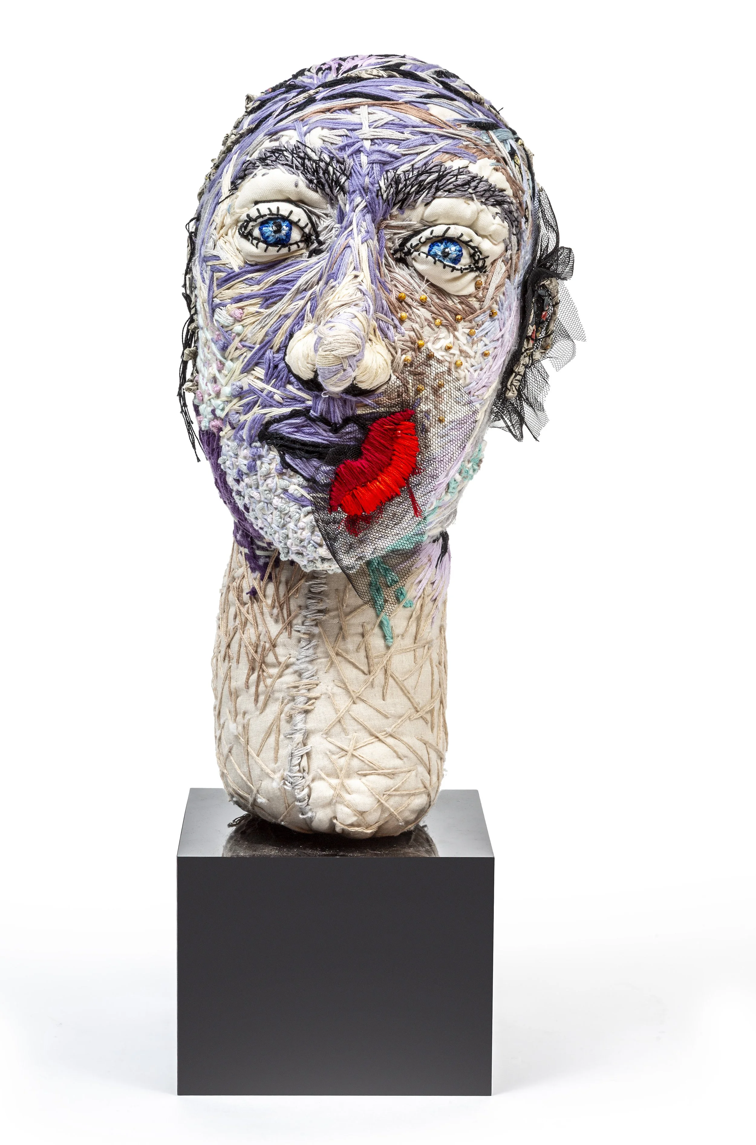 The Silent Type. Ish.                                       2025Linen, cotton, wool, acrylic, glass beads,
newspaper, perspex                                               68 x 24 x 34cm   