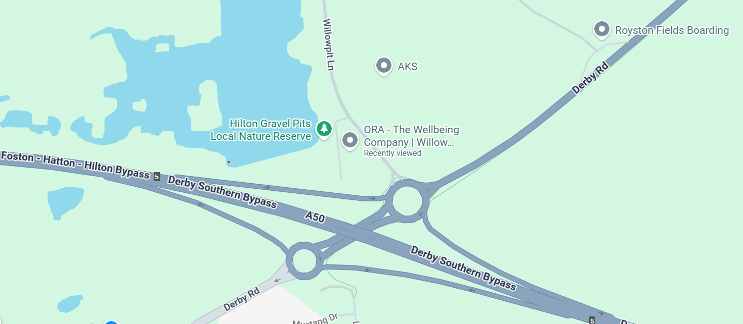 Map showing the area around Hilton Gravel Pits Local Nature Reserve, with roads including Derby Southern Bypass, A50, Derby Rd, and Willowpit Ln, and landmarks such as AKS, ORA The Wellbeing Company, Royston Fields Boarding, and Hilton Gravel Pits Nature Reserve.