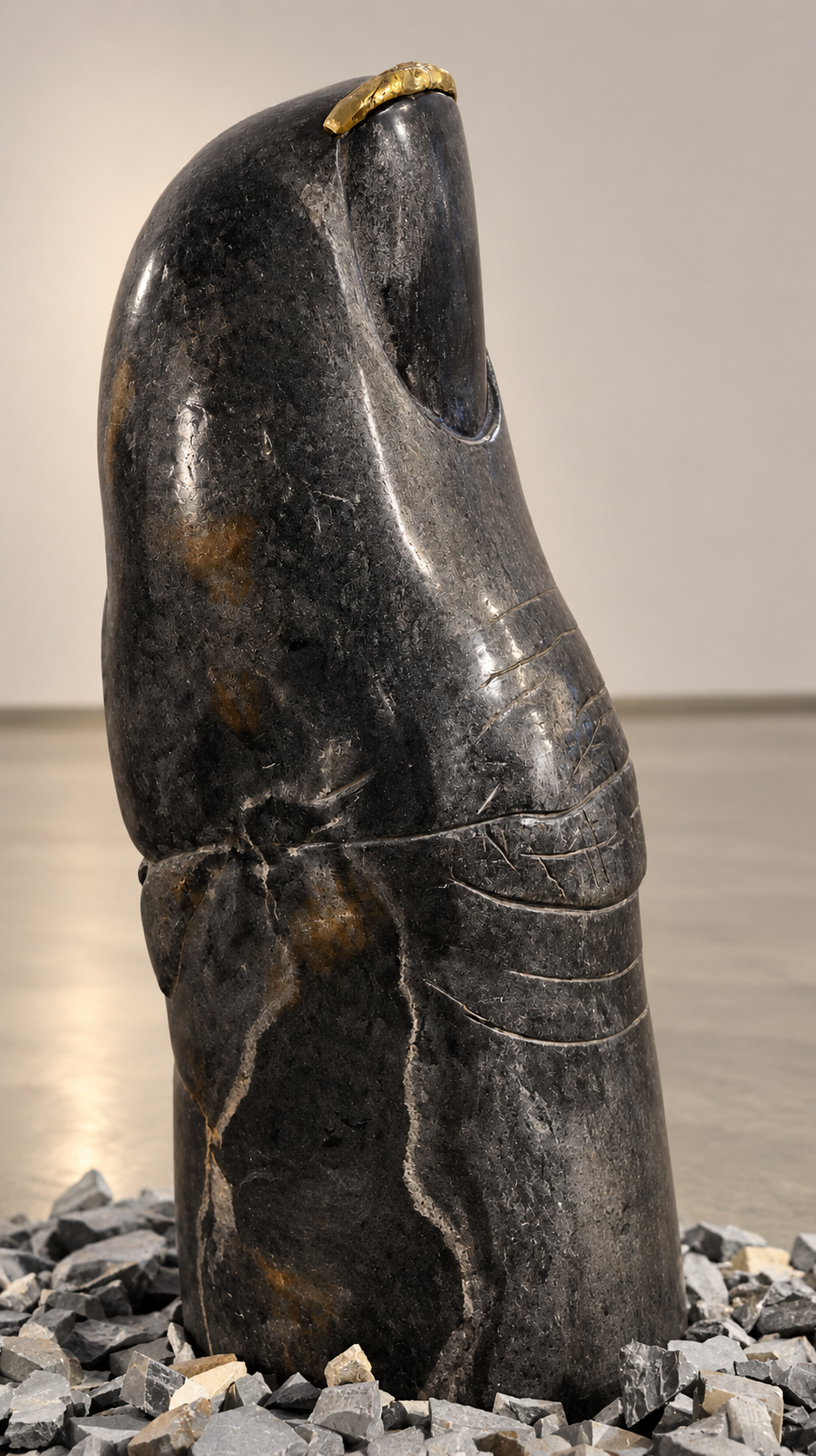 Dark Marble Sculpture with Gilded Crown.png