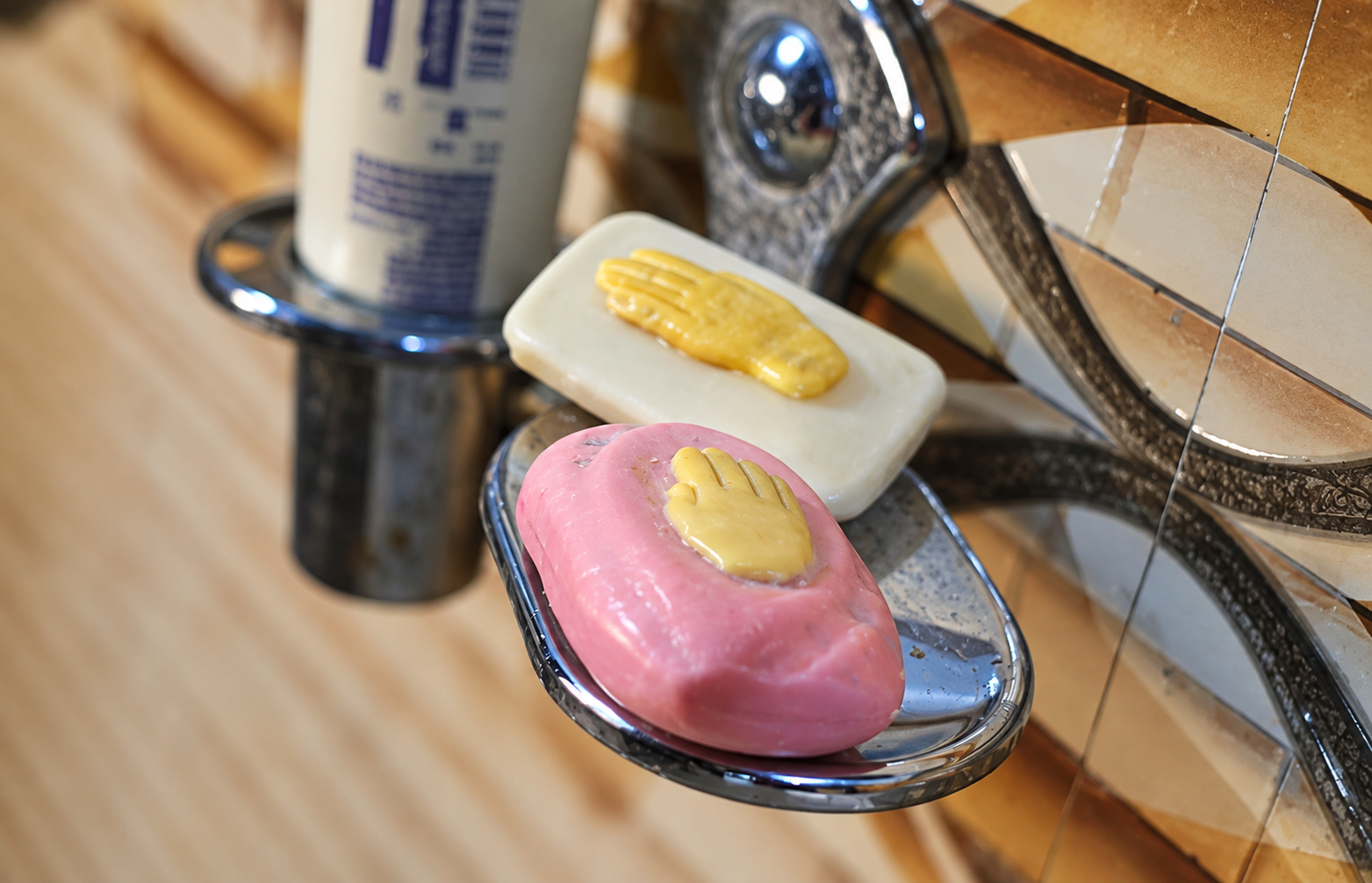 Hand-Shaped Soaps on Chrome Sink Tray.png