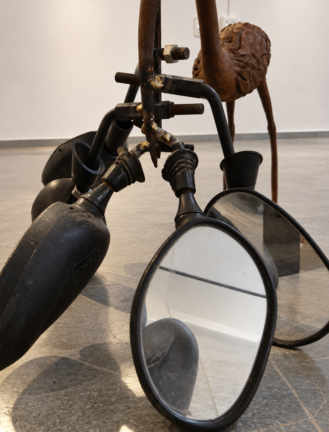Rusty Mechanical Bird Mirror Sculpture.png