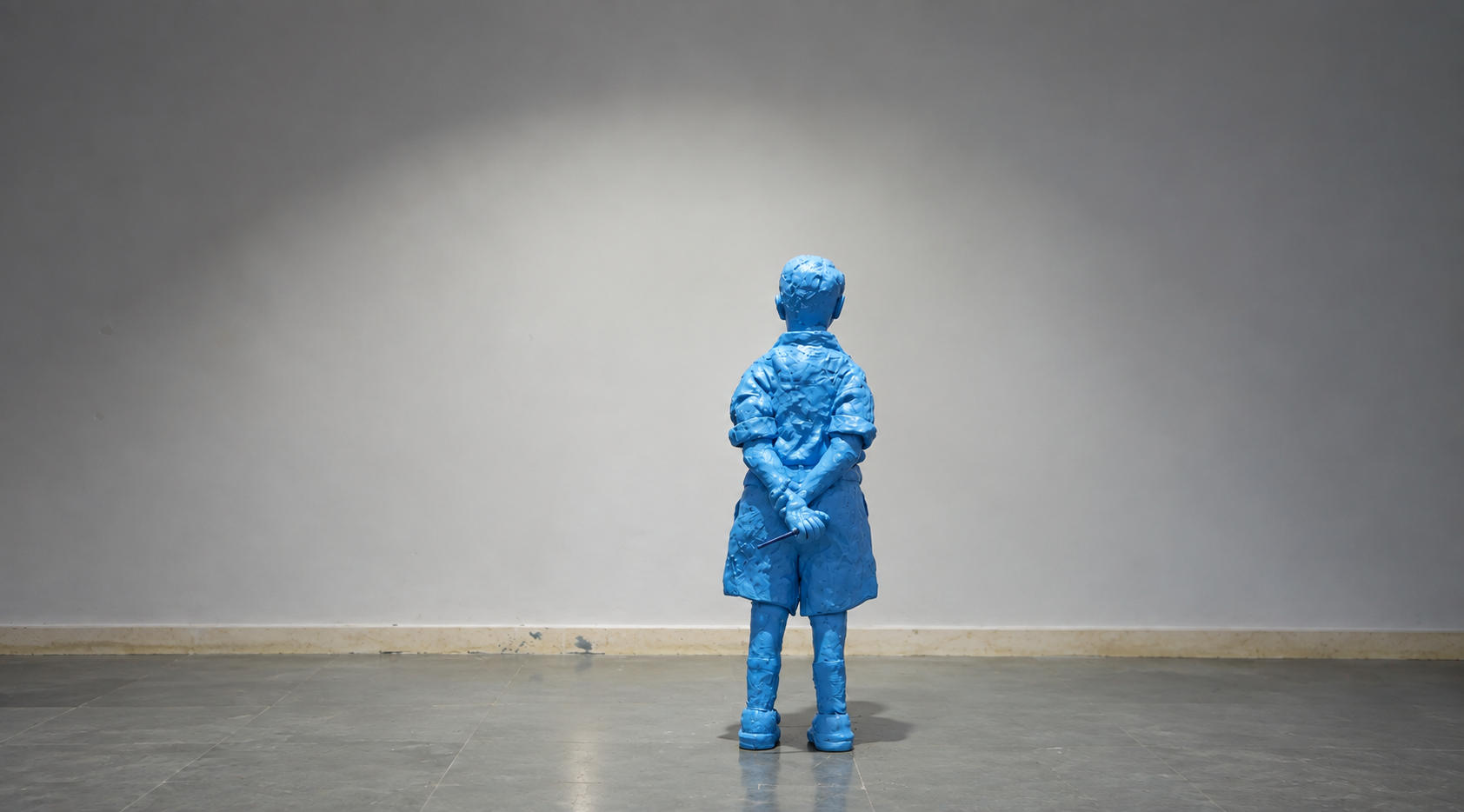 Blue Sculptural Figure in Gallery.png