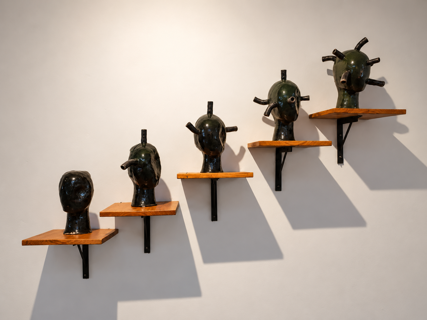 Ascending Ceramic Heads in Gallery Light.png