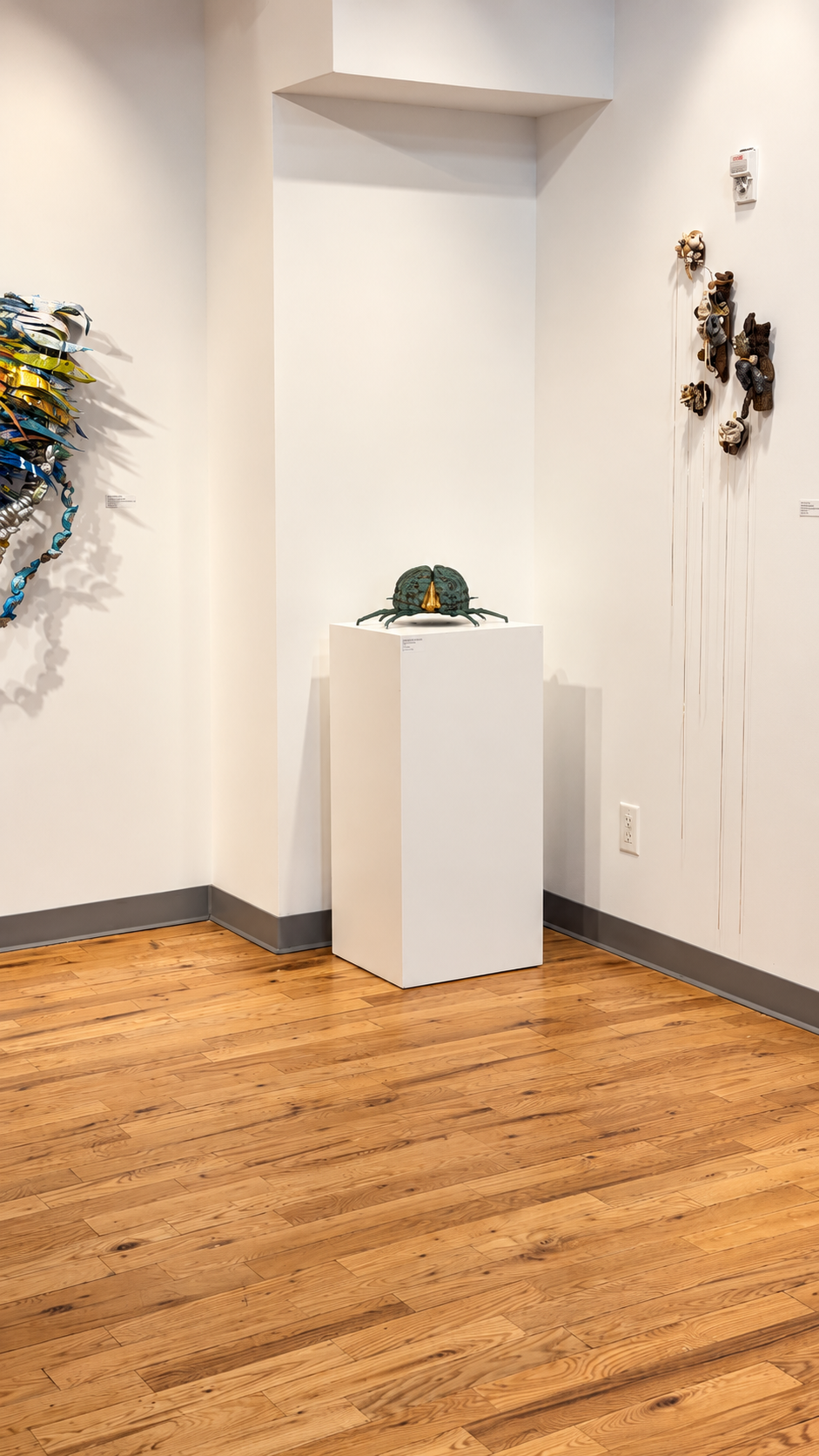 Minimal Gallery Corner with Crab Sculpture.png