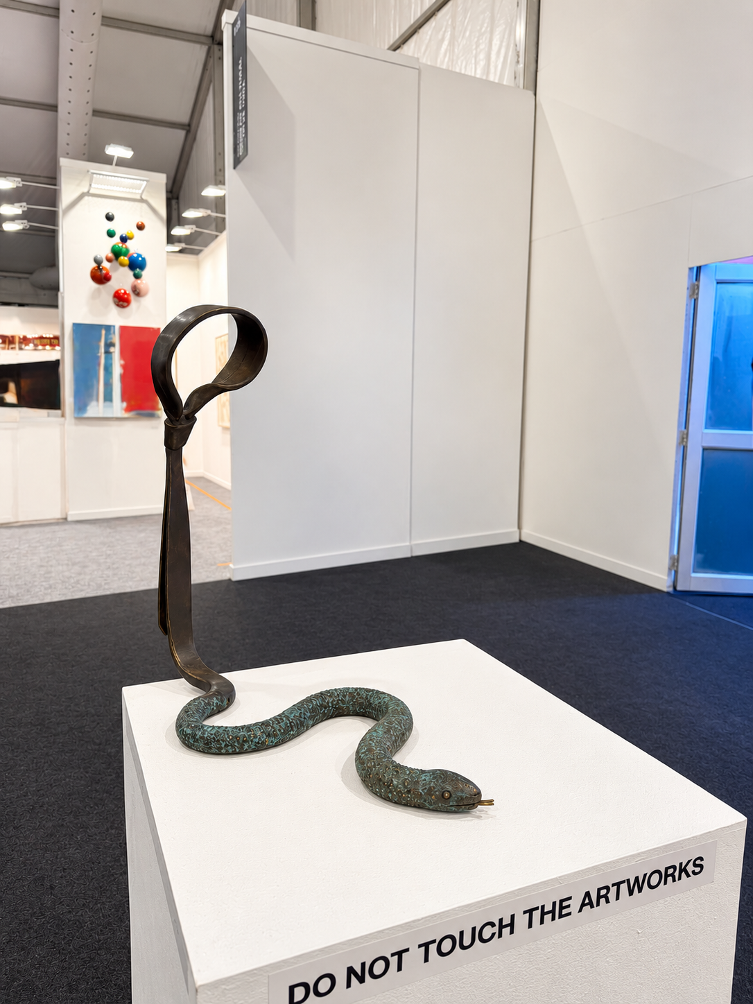 Looped Patina Serpent Sculpture.png