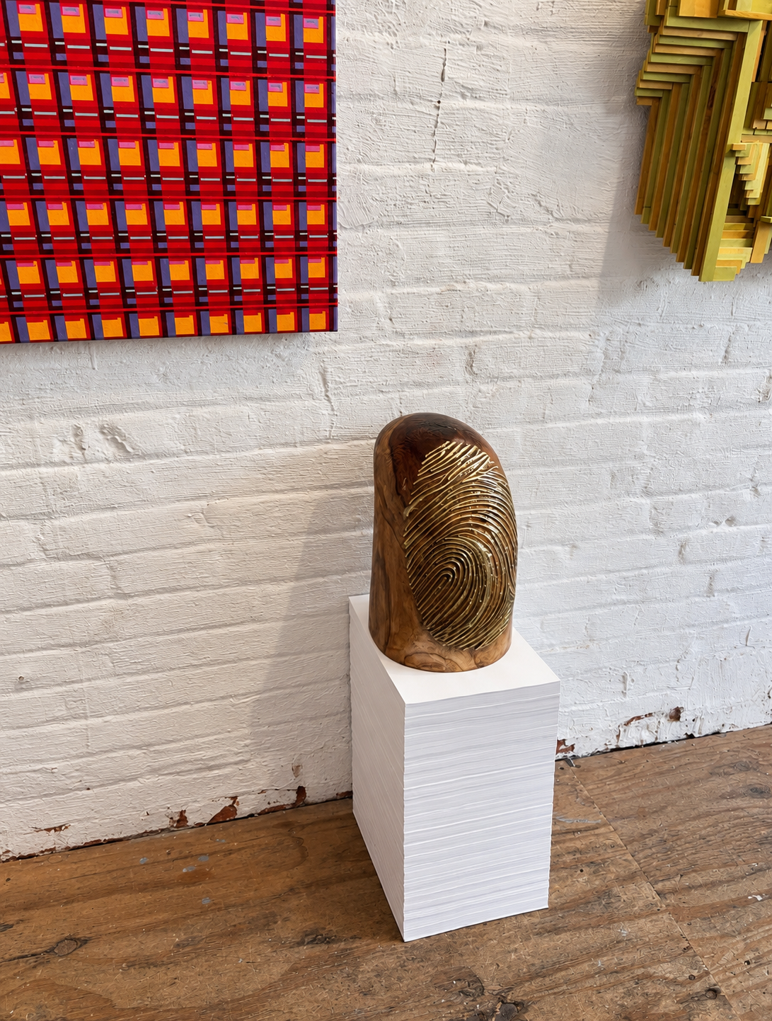 Fingerprint Wood Sculpture in Gallery.png