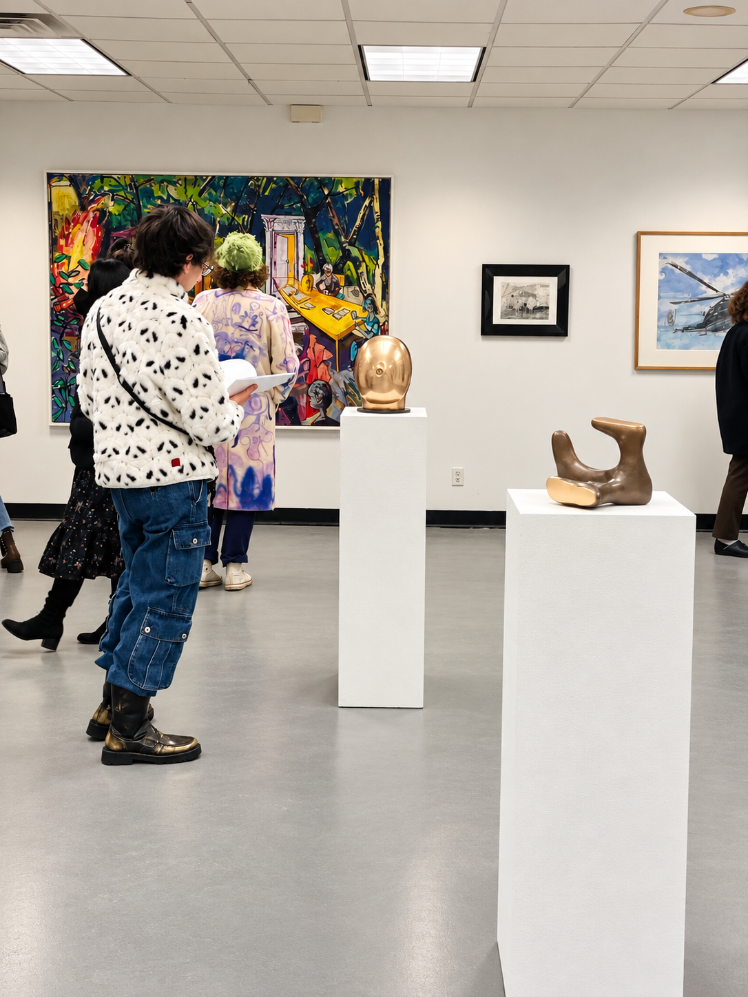Modern Gallery with Sculptures and Visitors.png