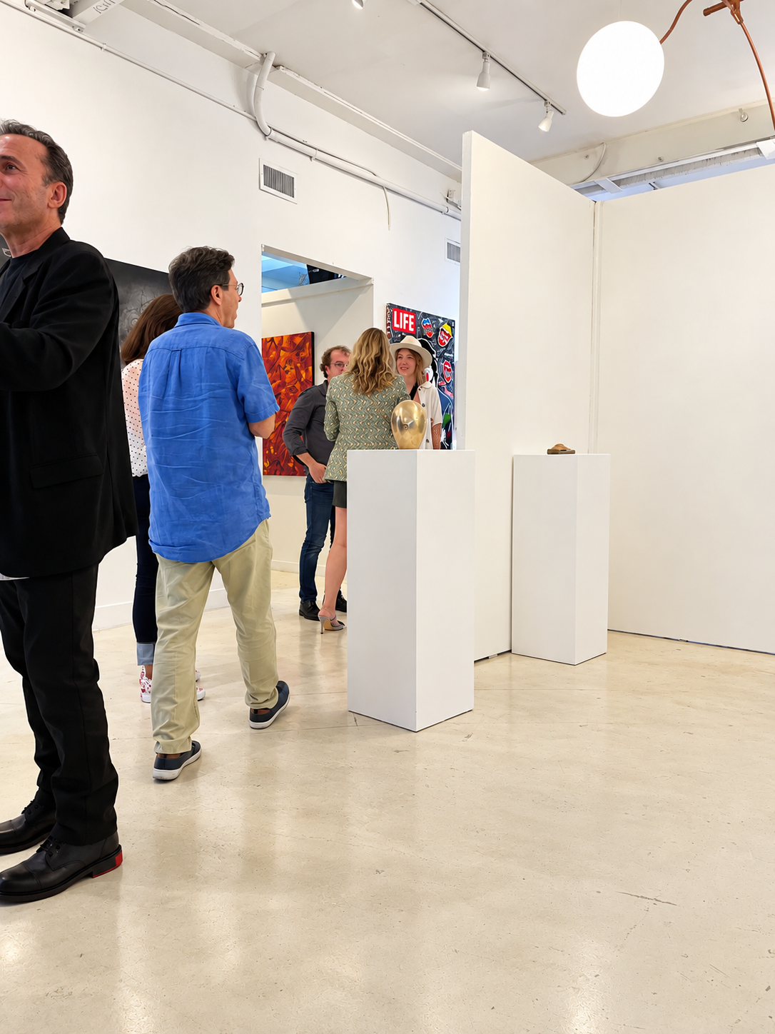 Candid Art Opening in a Modern Gallery.png