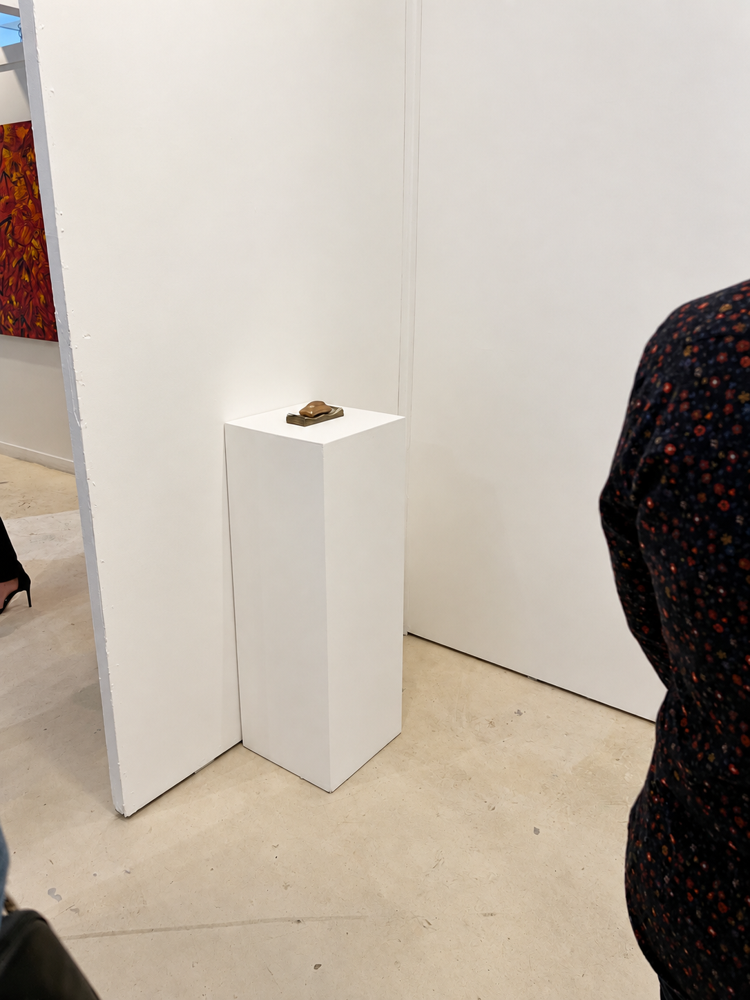 Minimalist Gallery with Bronze Sculpture.png