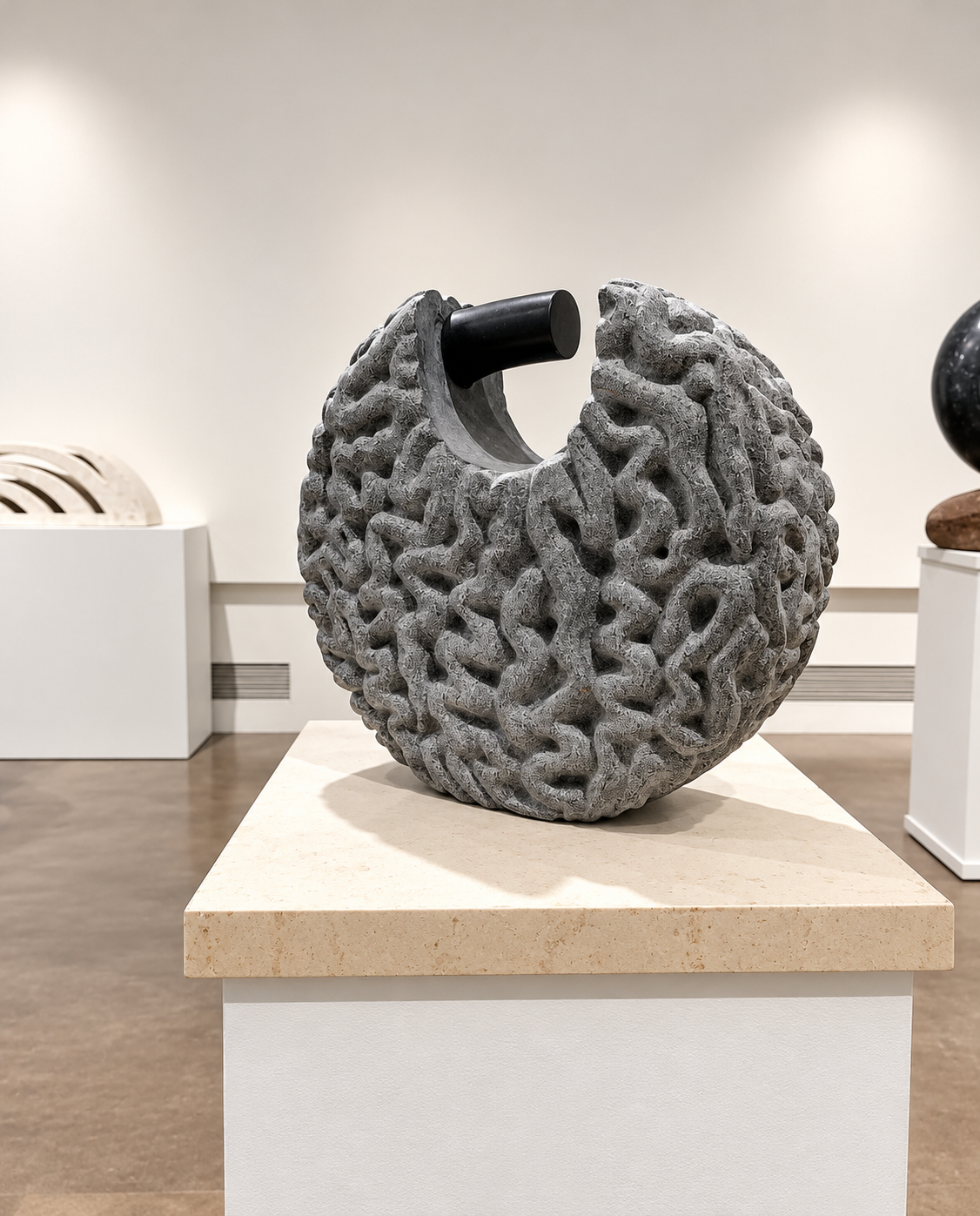 Textured Marble Sculpture in Gallery.png